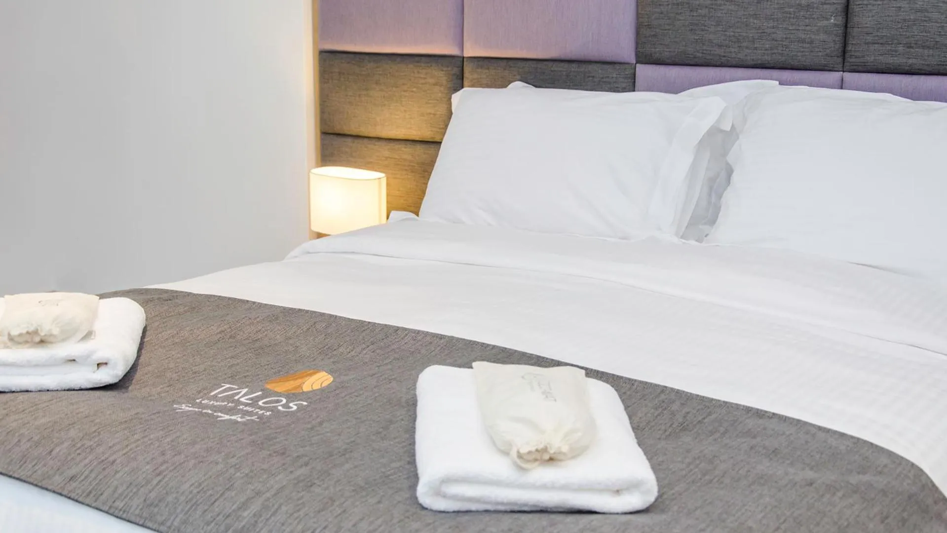 Bed in Talos Luxury Suites