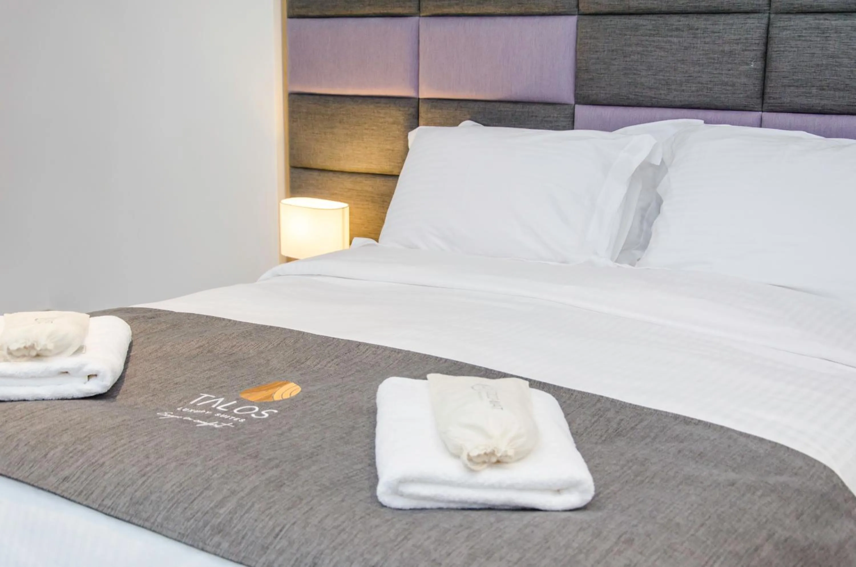 Bed in Talos Luxury Suites