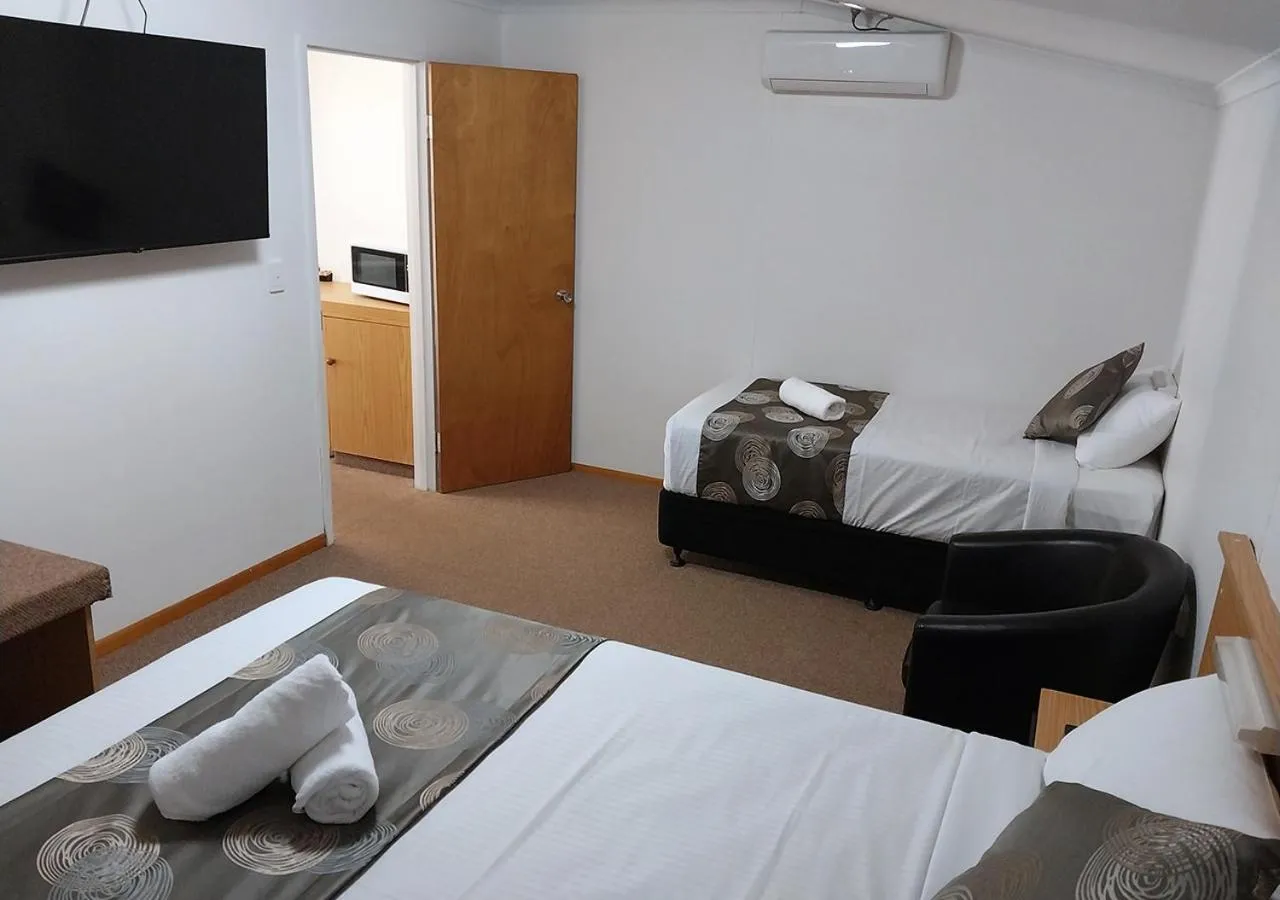 Bed in Blue Shades Motel