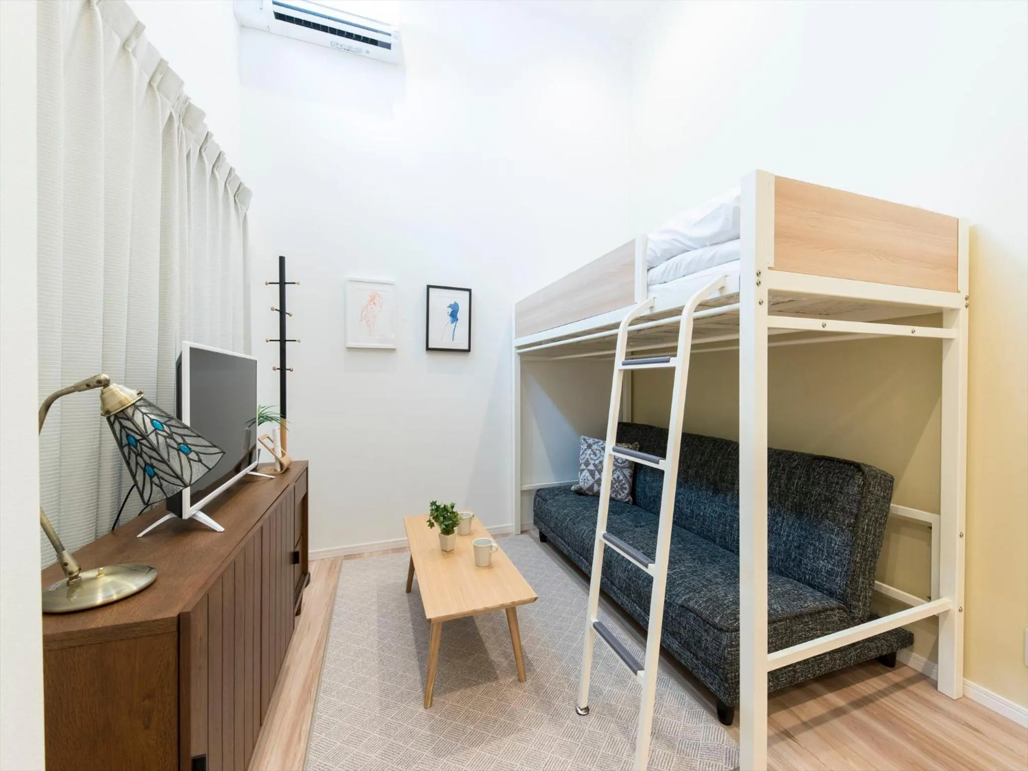 Living room, Bed in TRIP POD SUMIYOSHI C