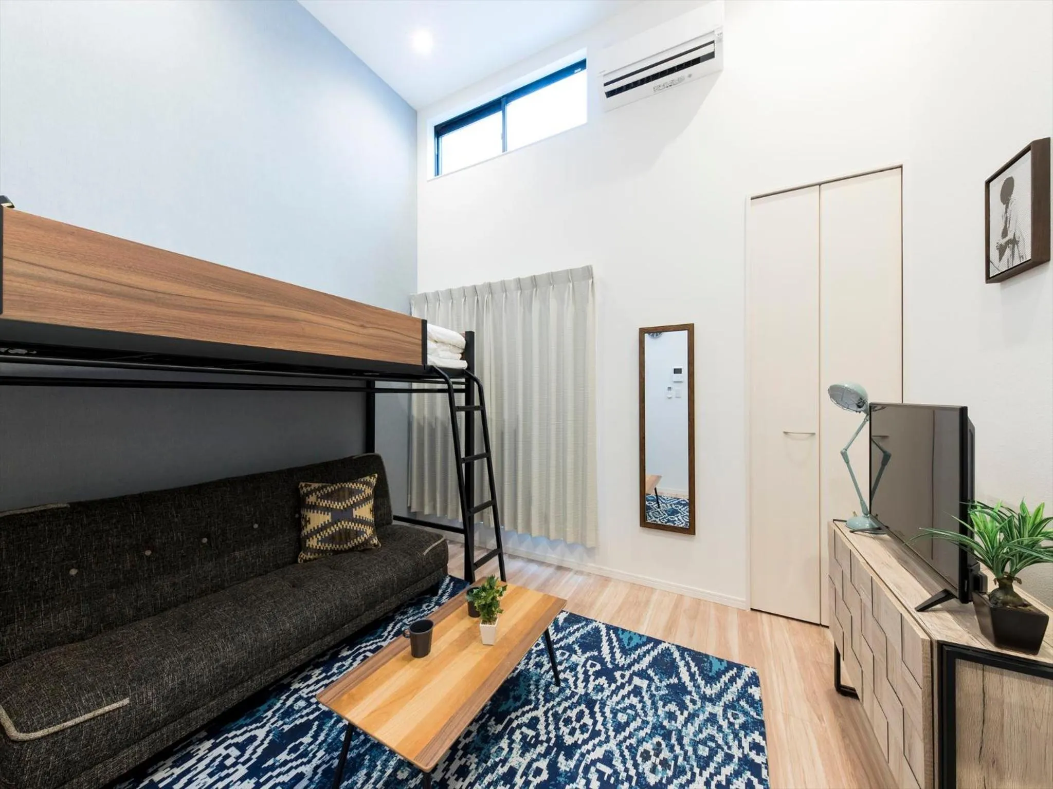 Living room, Bed in TRIP POD SUMIYOSHI C