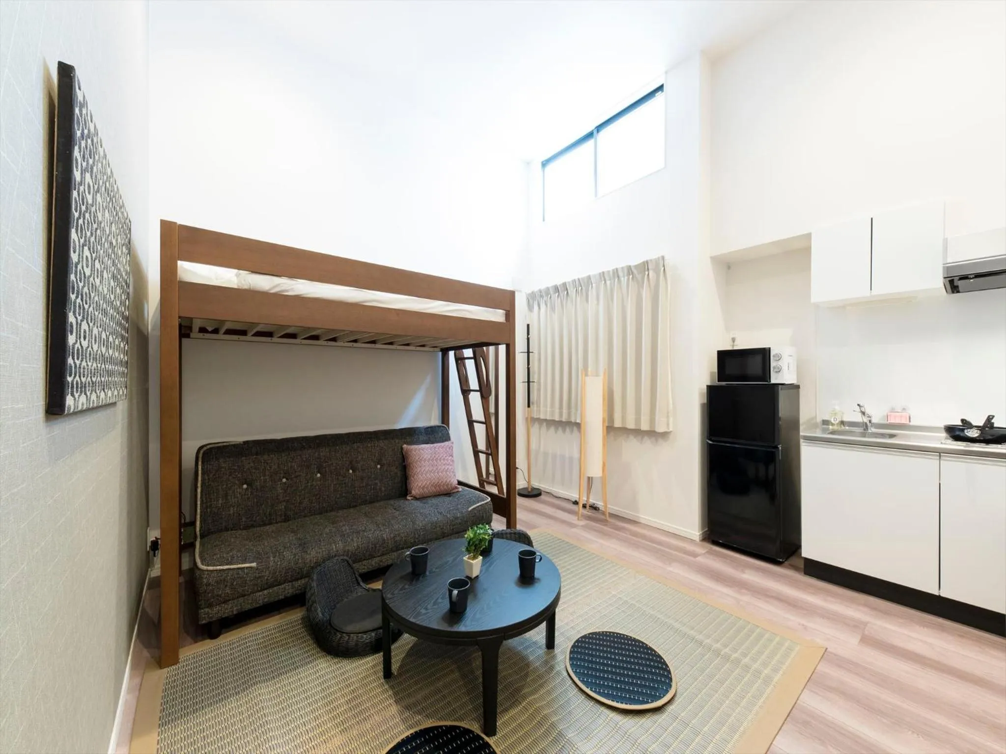 Living room in TRIP POD TOJIN-MACHI A