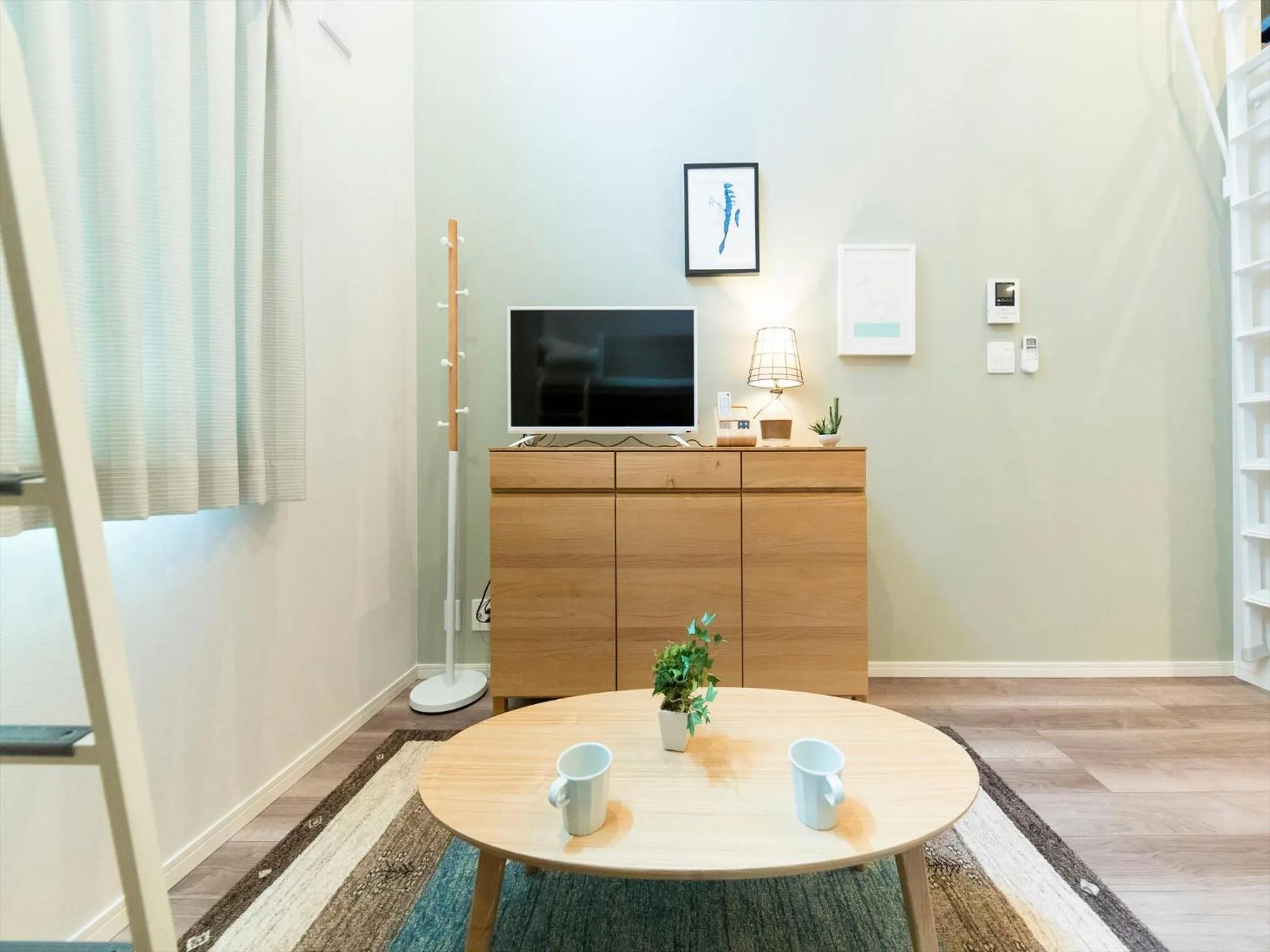 Living room in TRIP POD TOJIN-MACHI A