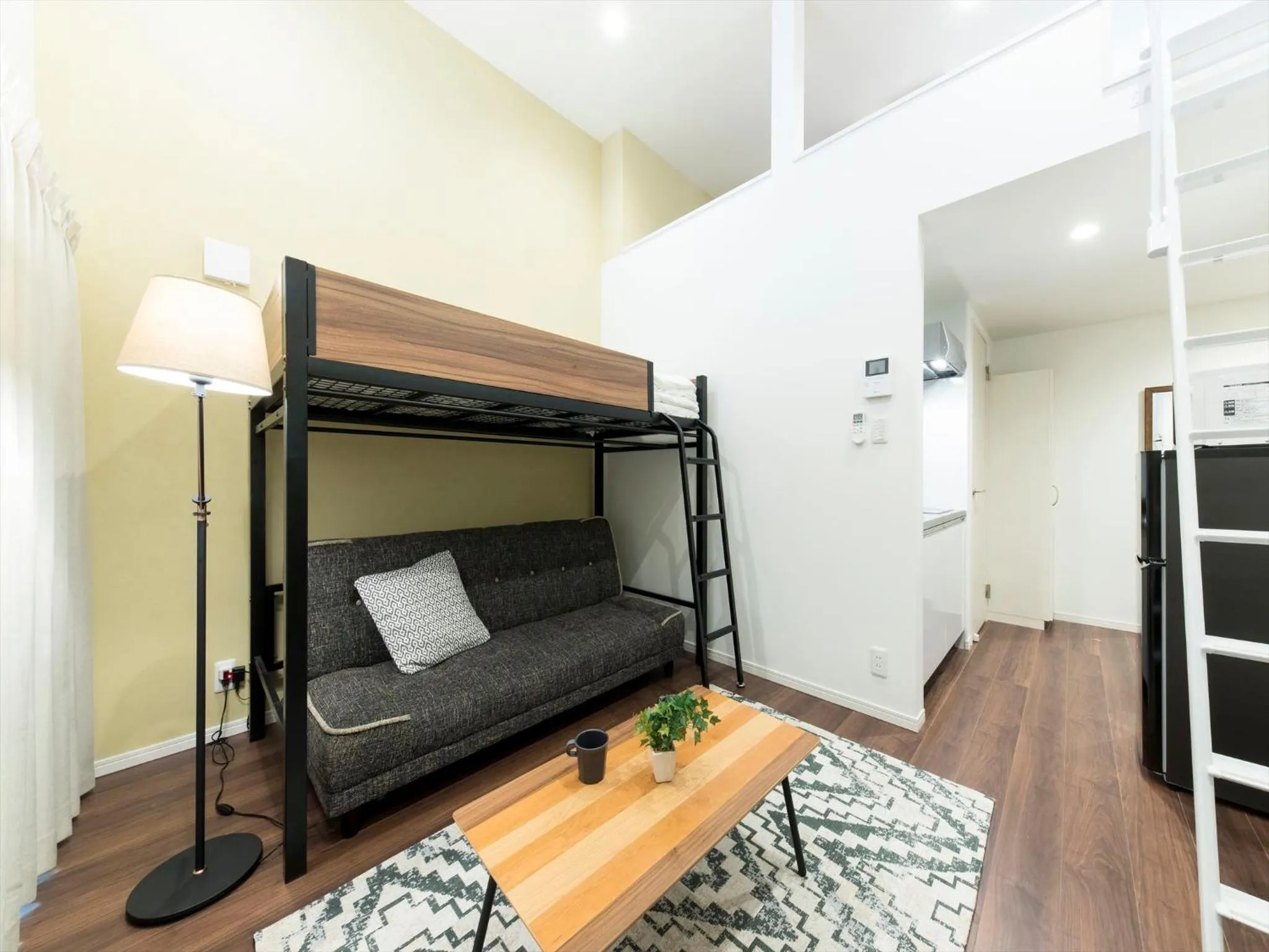 Living room, Bed in TRIP POD SUMIYOSHI A