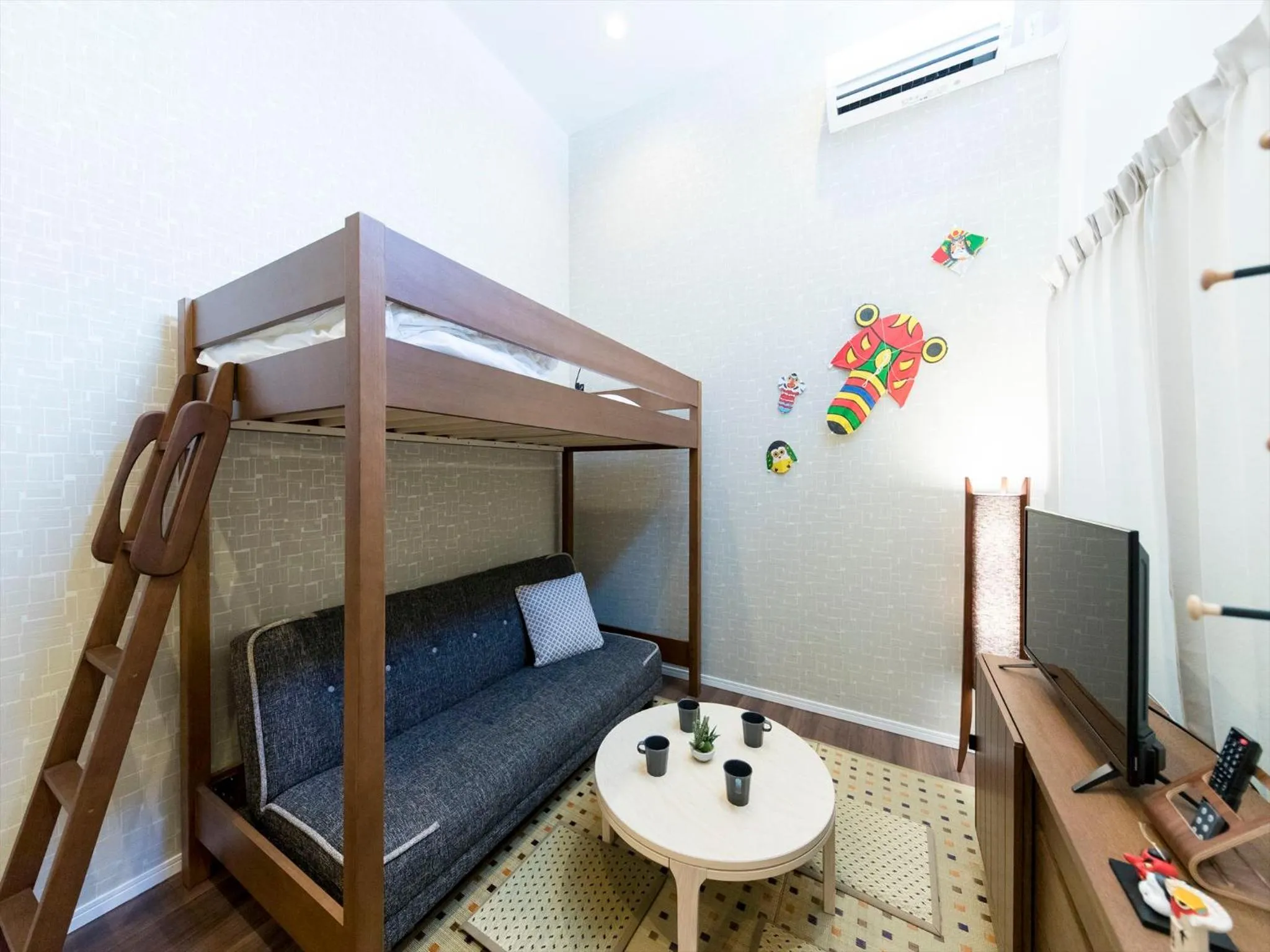 Living room, Bed in TRIP POD SUMIYOSHI A