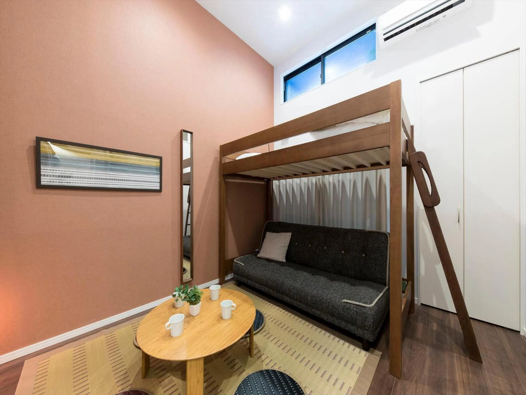 Living room, Bed in TRIP POD SUMIYOSHI A