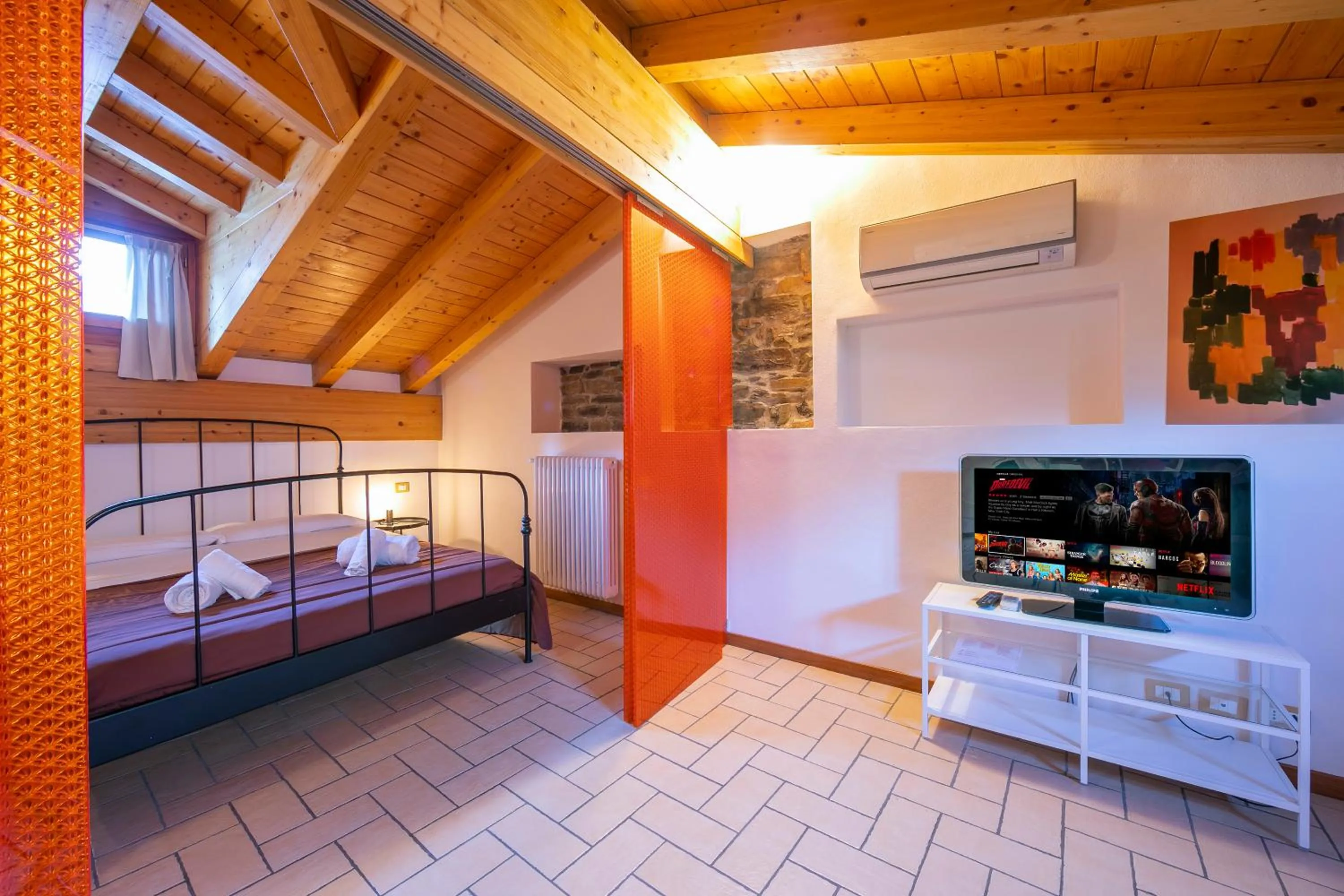 Seating area, Bed in Le Stanze del Lago Apartments
