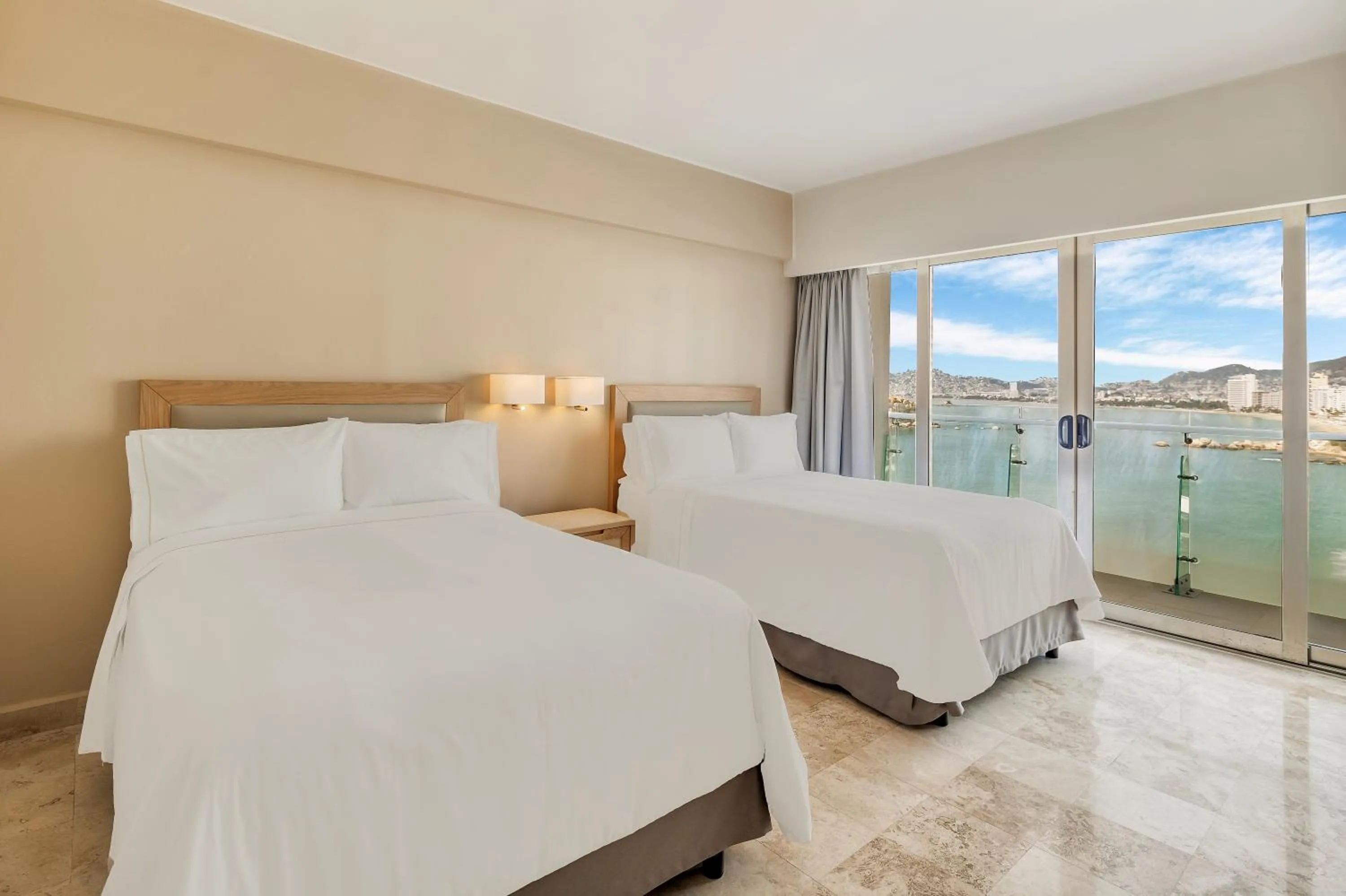 Bed in Fiesta Americana Acapulco Villas