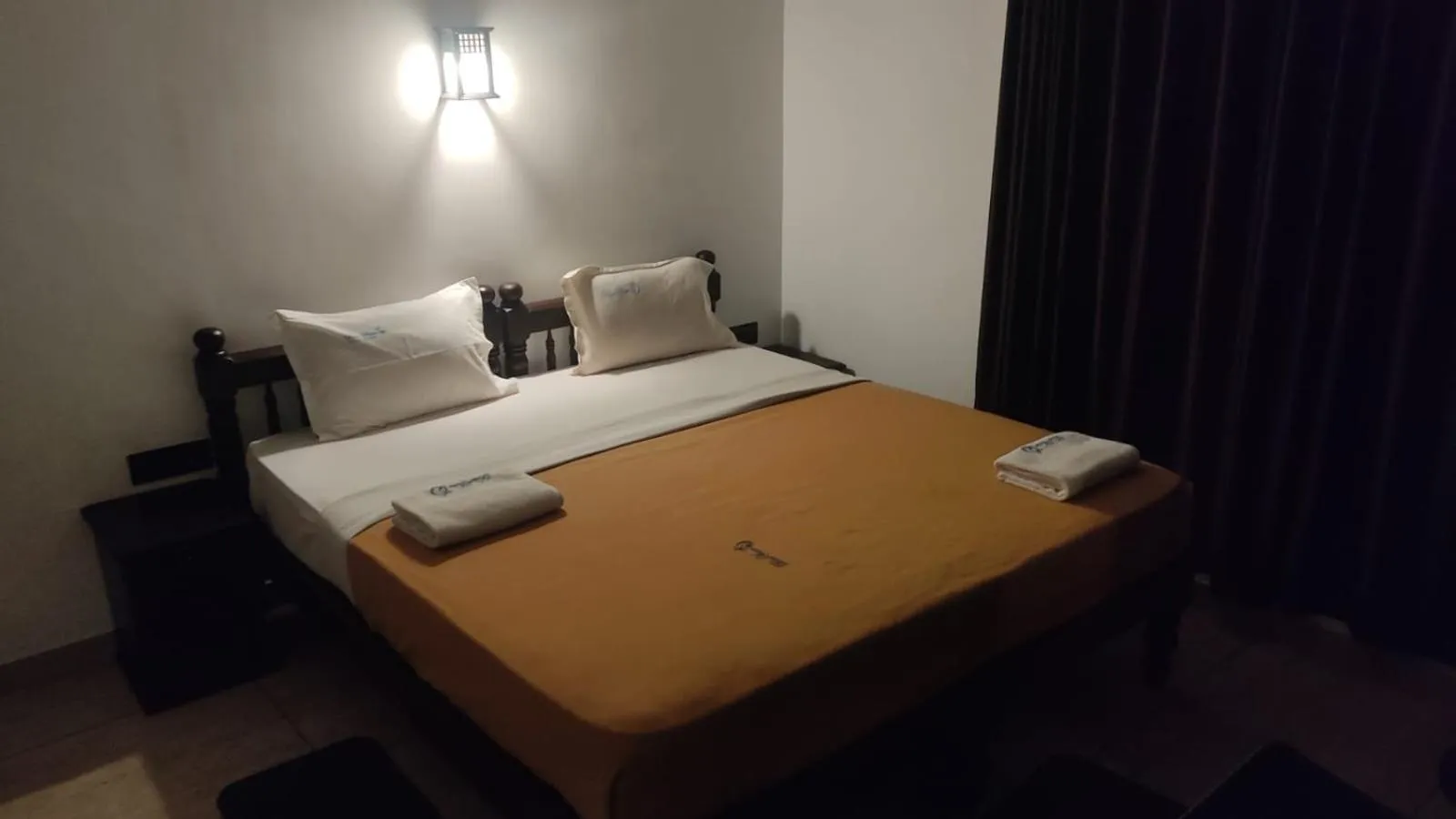 Bed in Blue Water Beach Resort