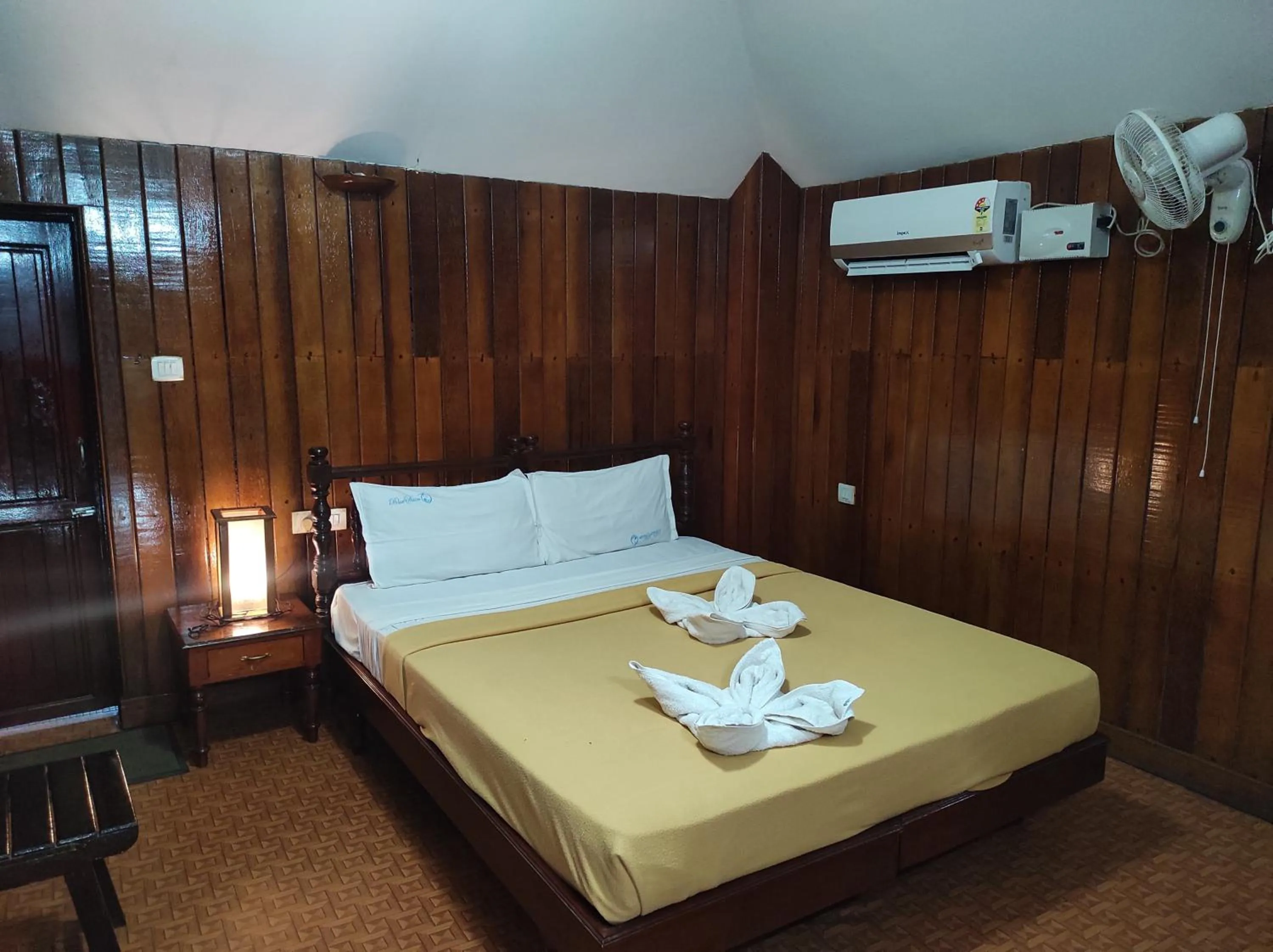 Bed in Blue Water Beach Resort