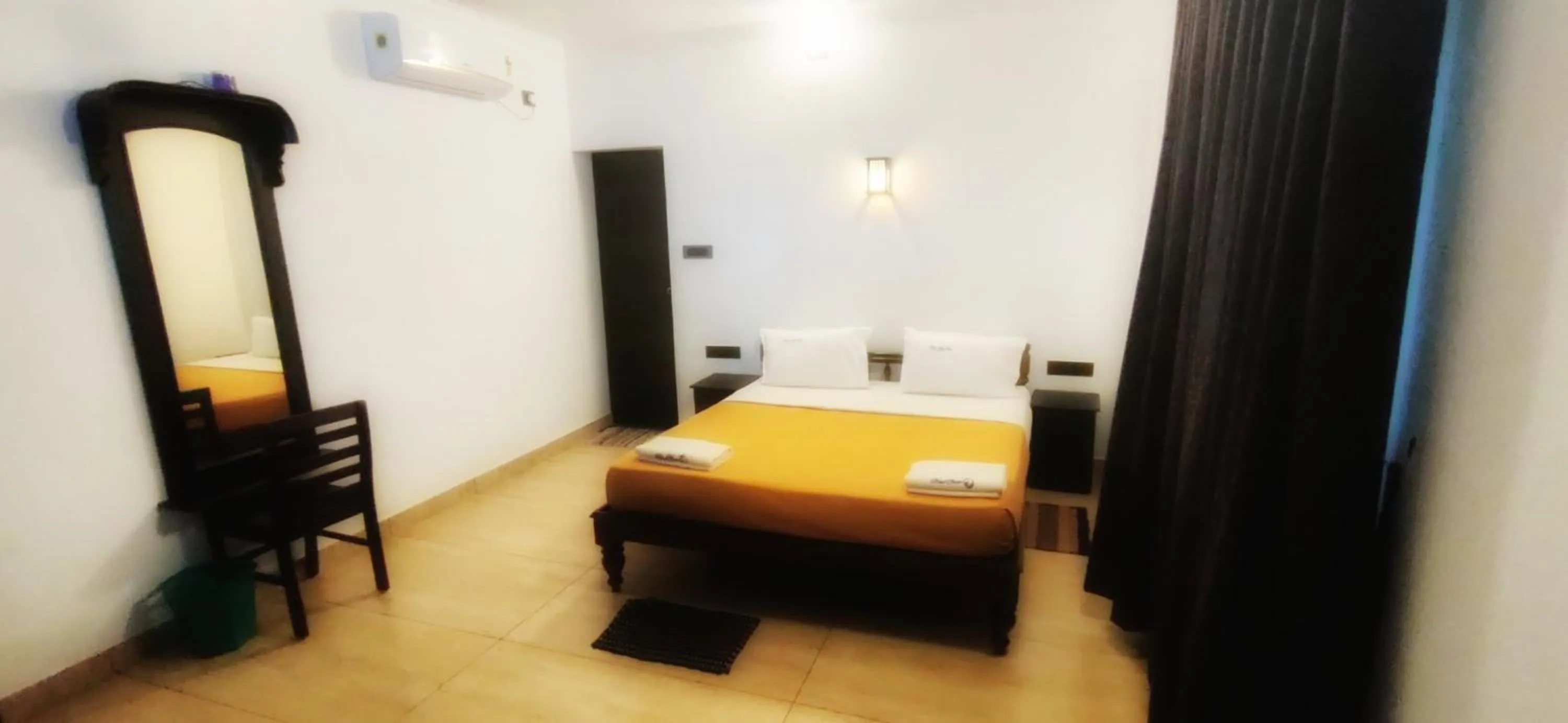 Bed in Blue Water Beach Resort