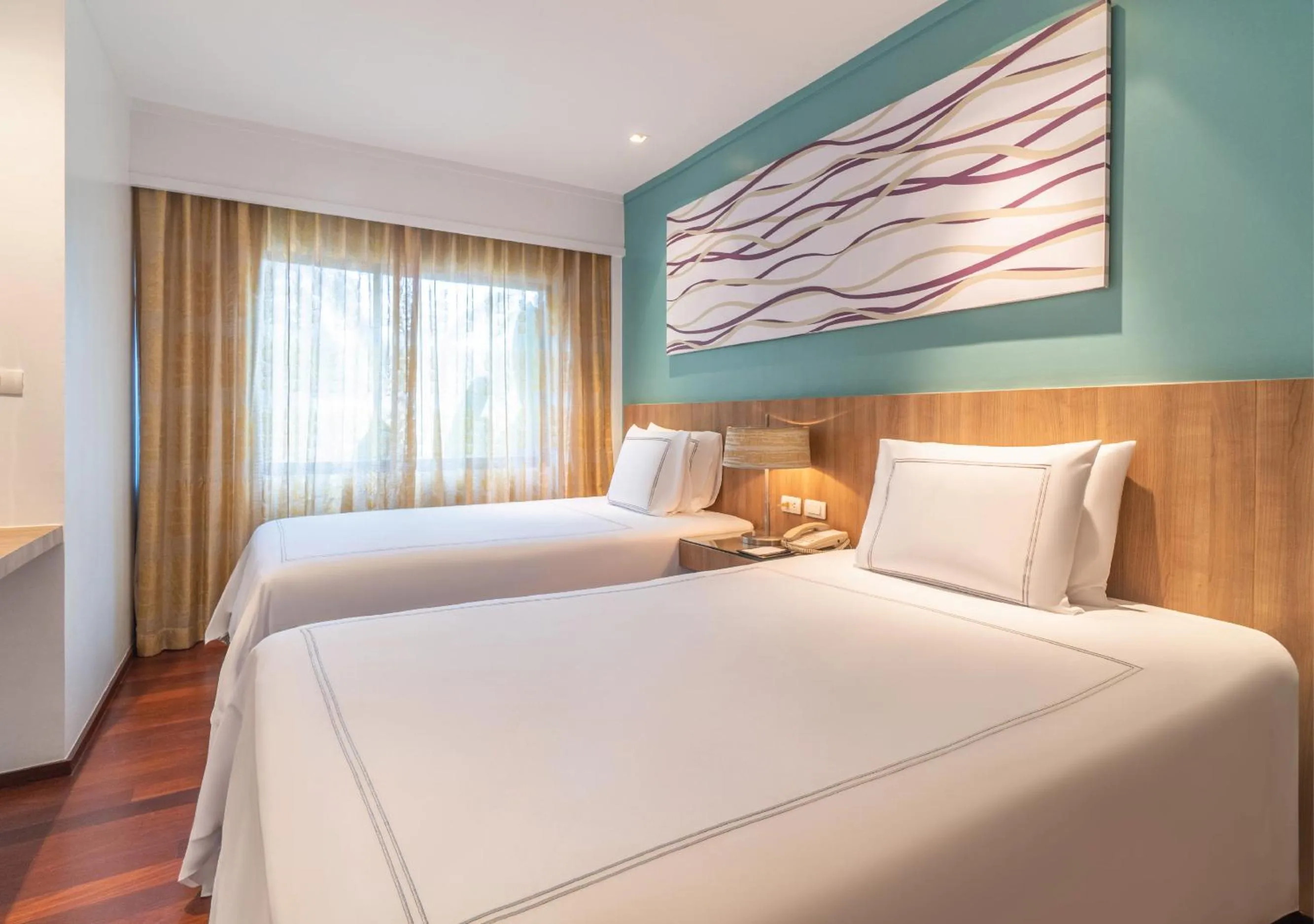 Bed in Radisson Resort and Suites Phuket