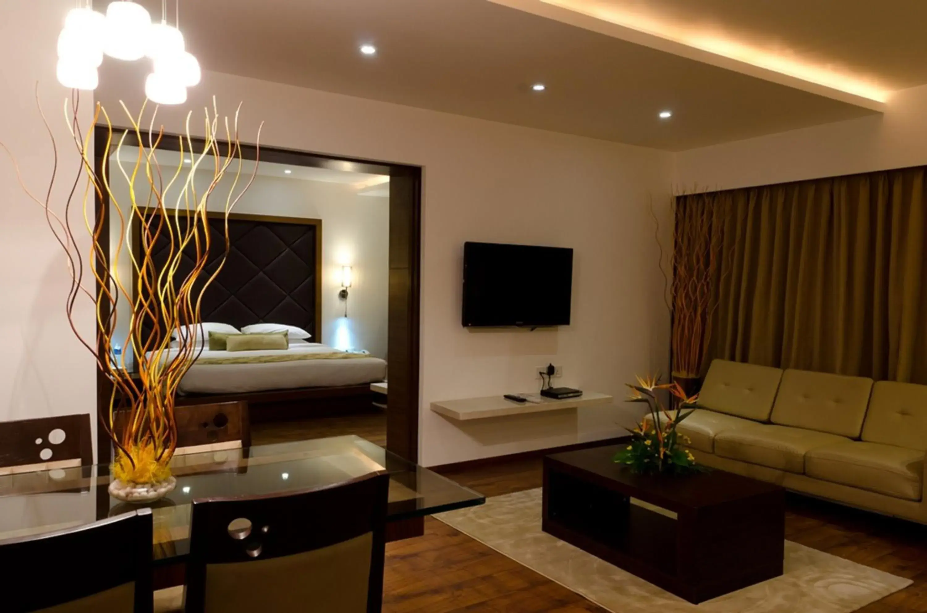 Seating area, Bed in Ramee Grand Hotel and Spa, Pune Seating area, Bed in Ramee Grand Hotel and Spa, Pune