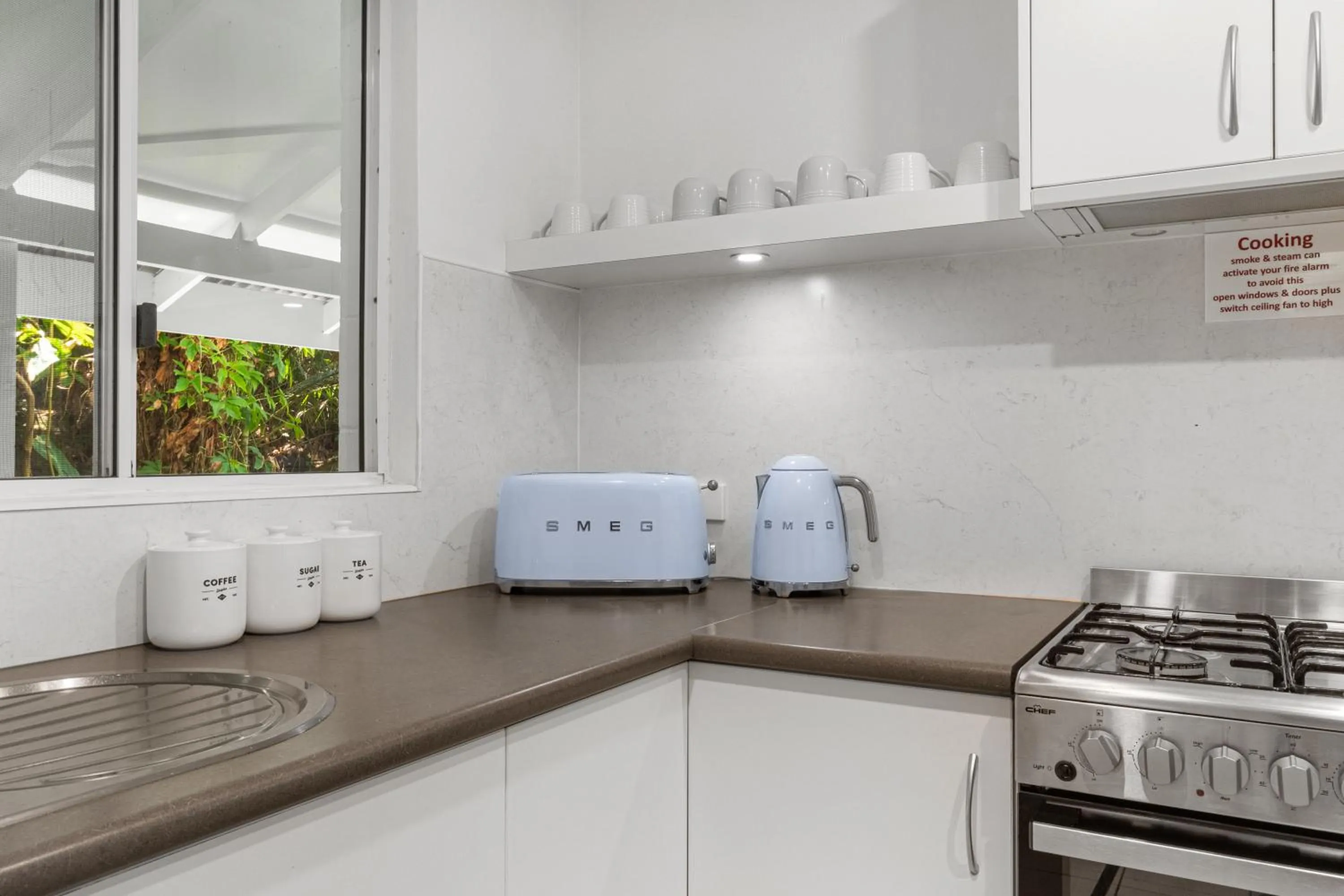 Kitchen or kitchenette in By The Sea Port Douglas