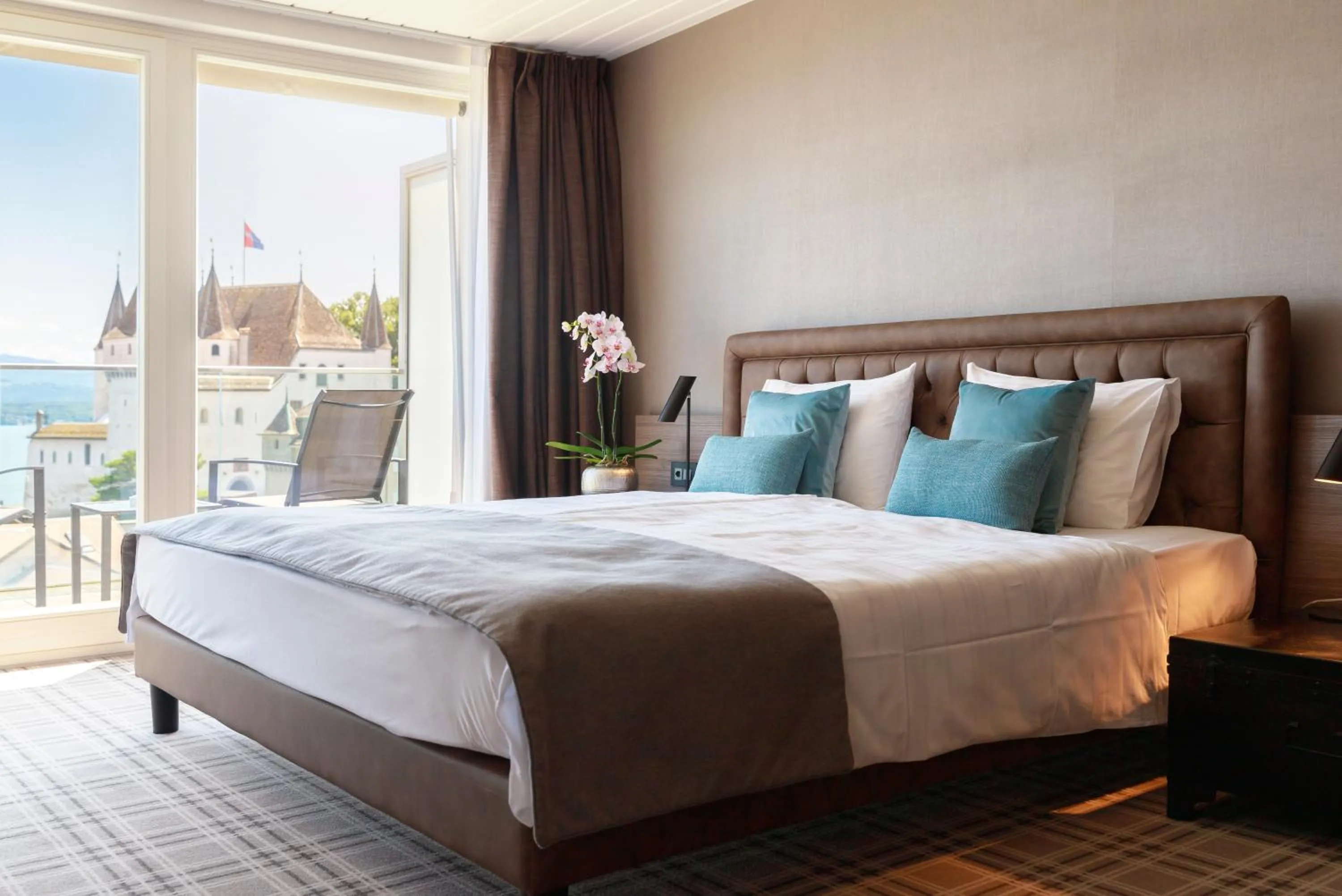 Bed in Ambassador Boutique Hotel