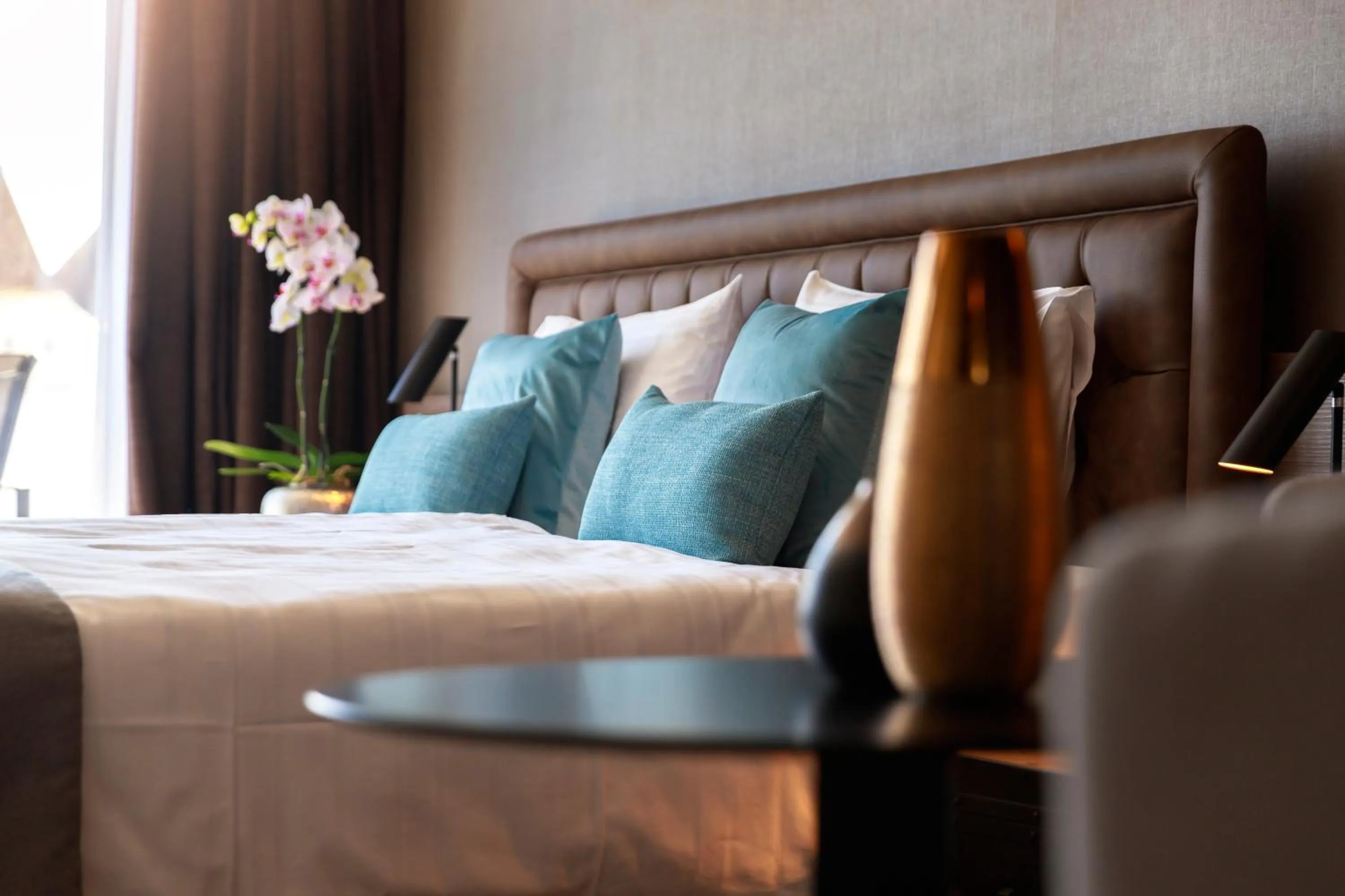 Bed in Ambassador Boutique Hotel