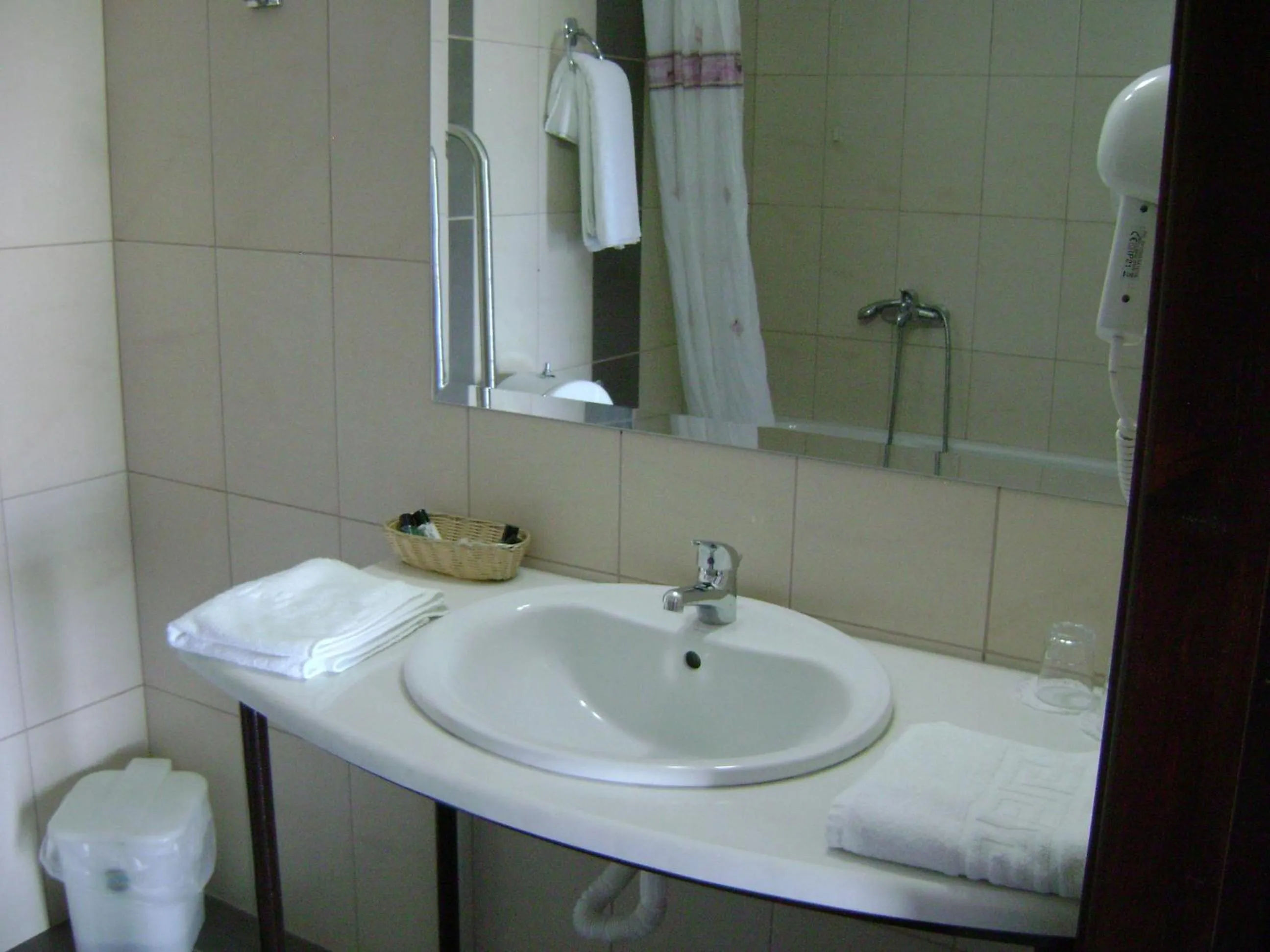 Bathroom in Rihios Hotel