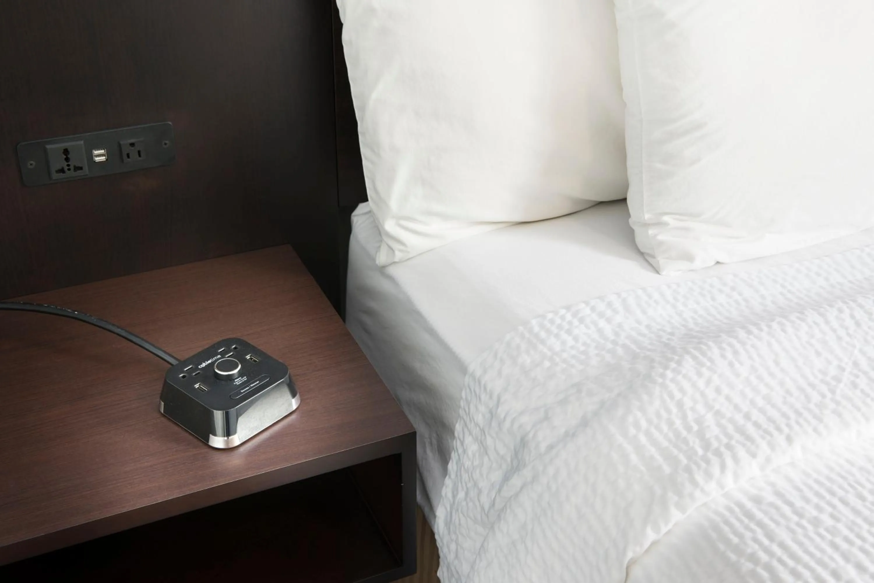 Bed in Luxbury Inn & Suites