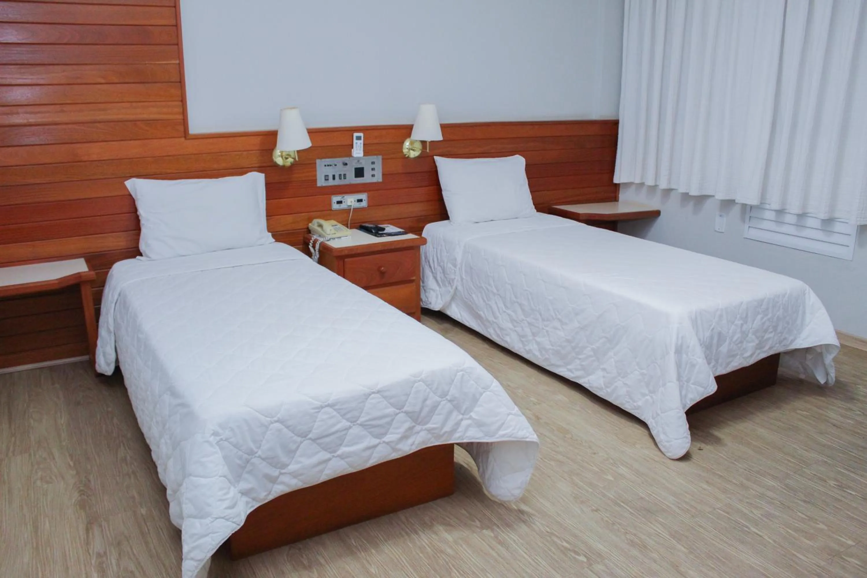 Bed in HD Plaza Hotel