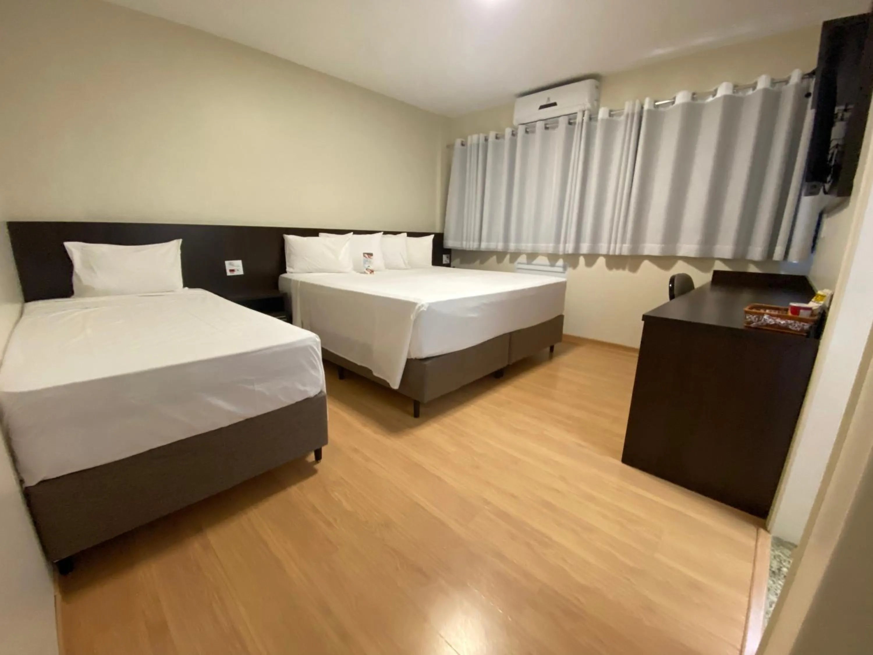 Bed in HD Plaza Hotel