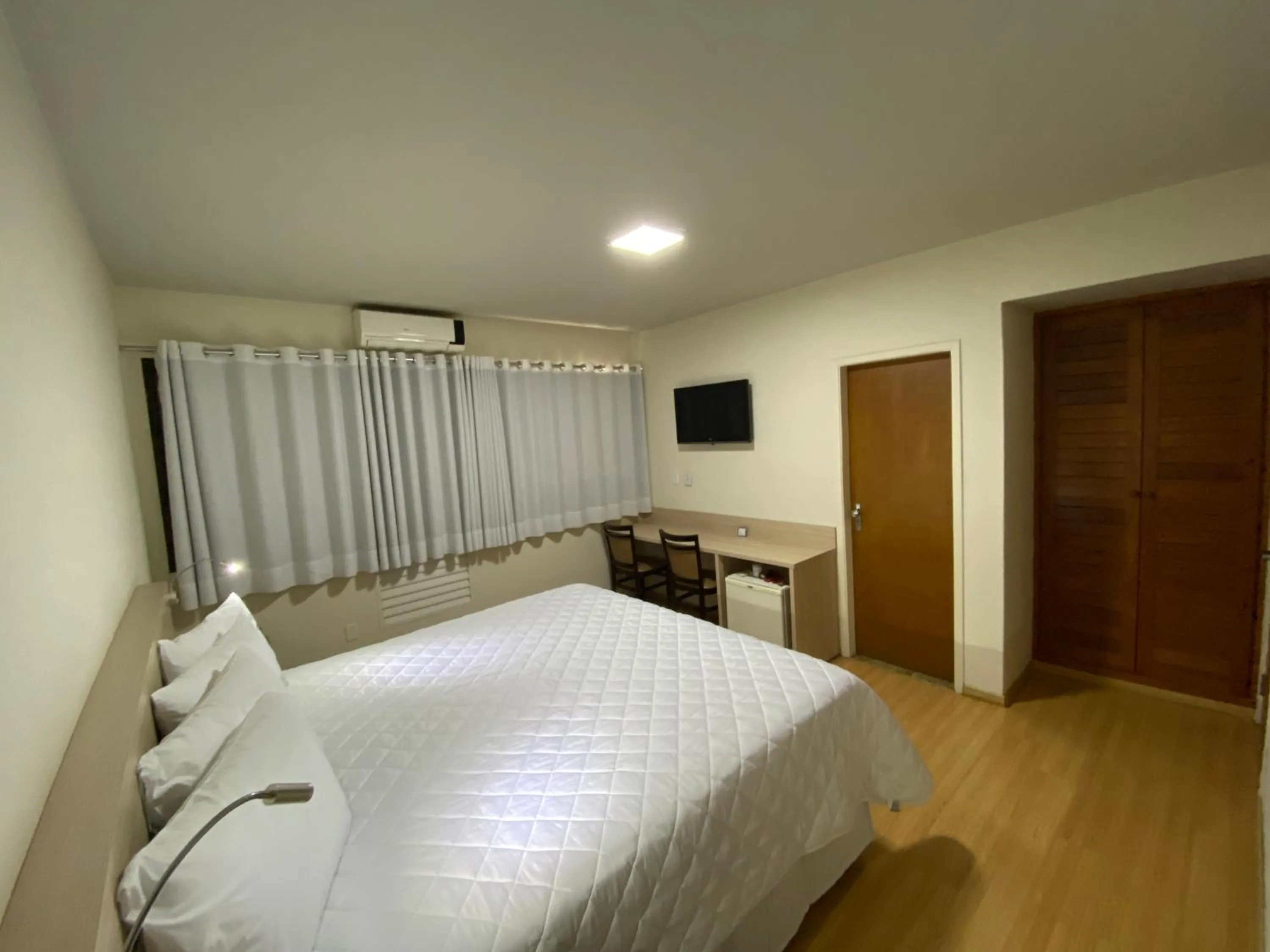 Bed in HD Plaza Hotel