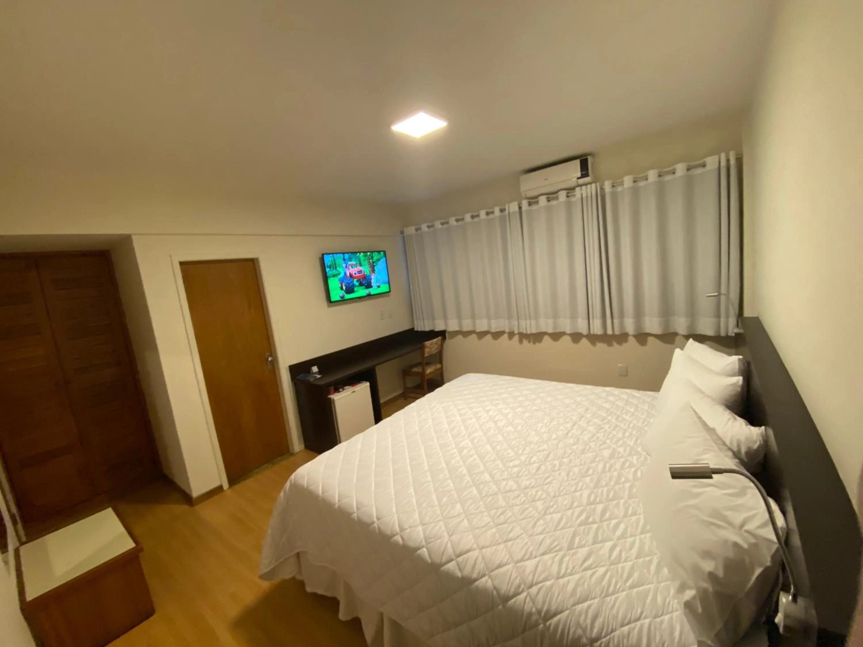 Bed in HD Plaza Hotel