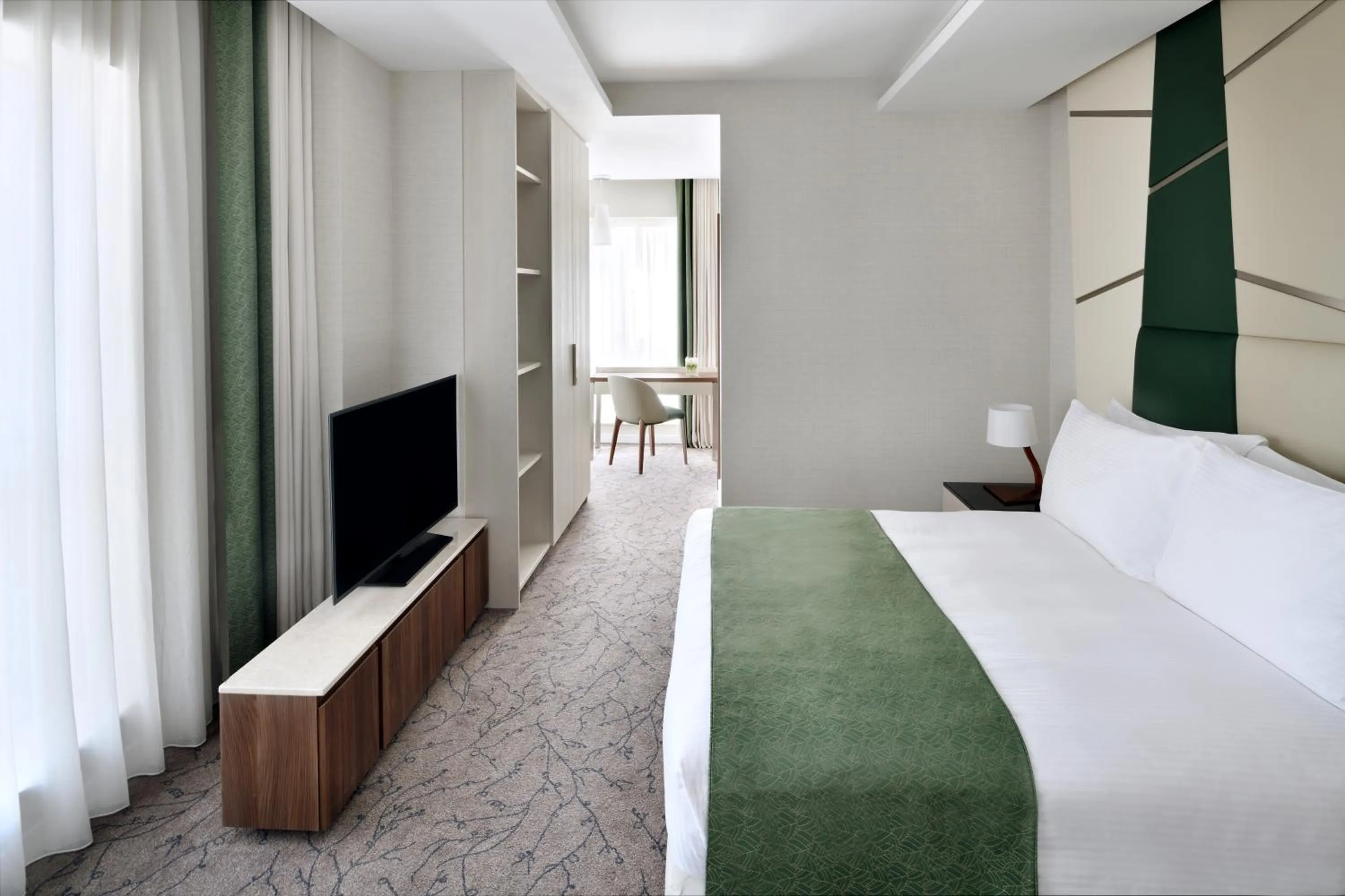 Bed in Mövenpick Hotel Apartments Downtown Dubai