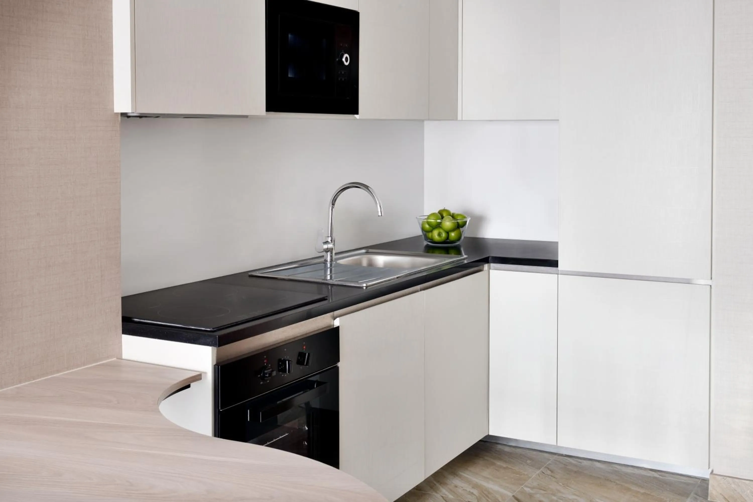 Kitchen or kitchenette in Mövenpick Hotel Apartments Downtown Dubai