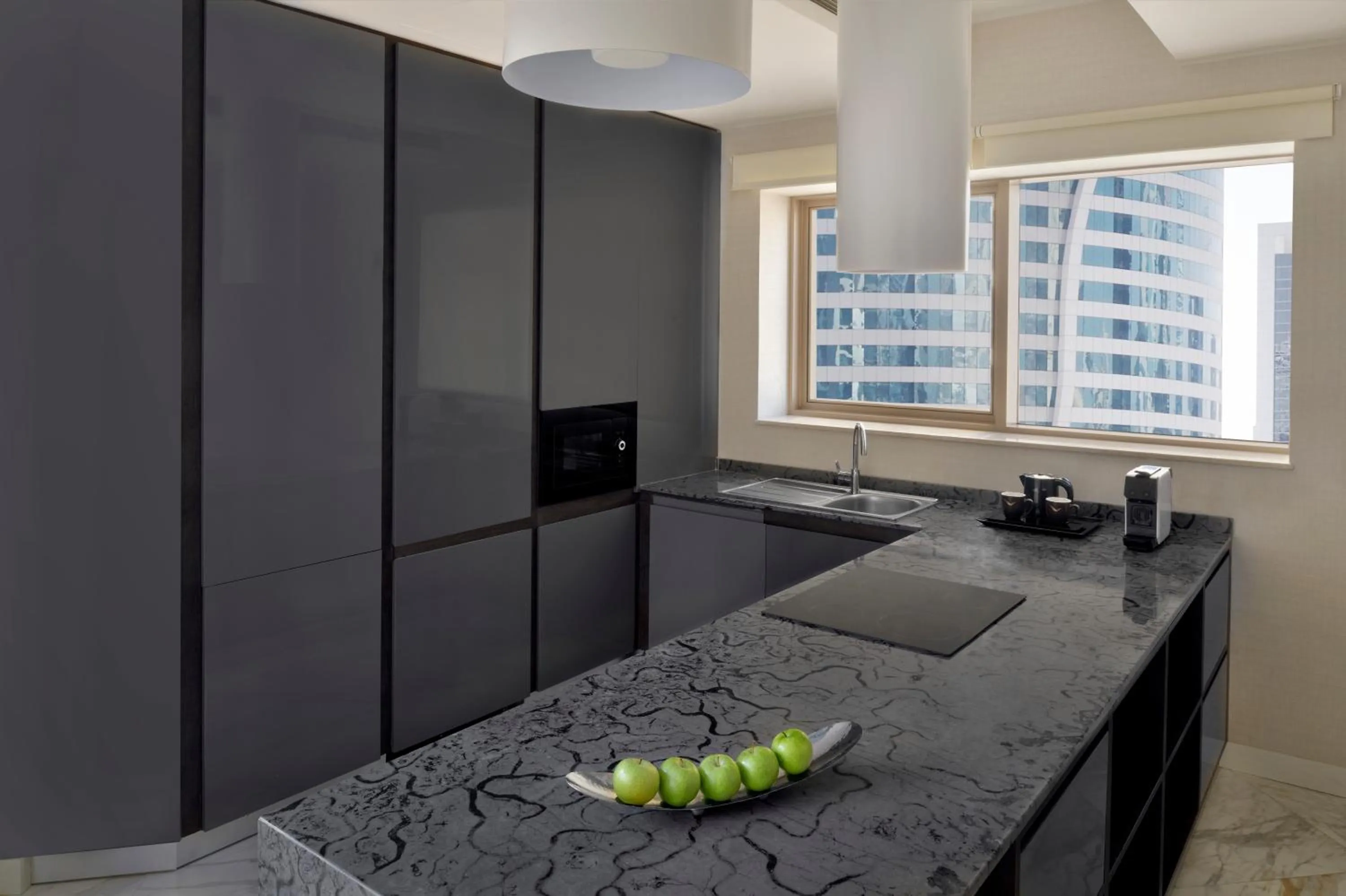 Communal kitchen in Mövenpick Hotel Apartments Downtown Dubai