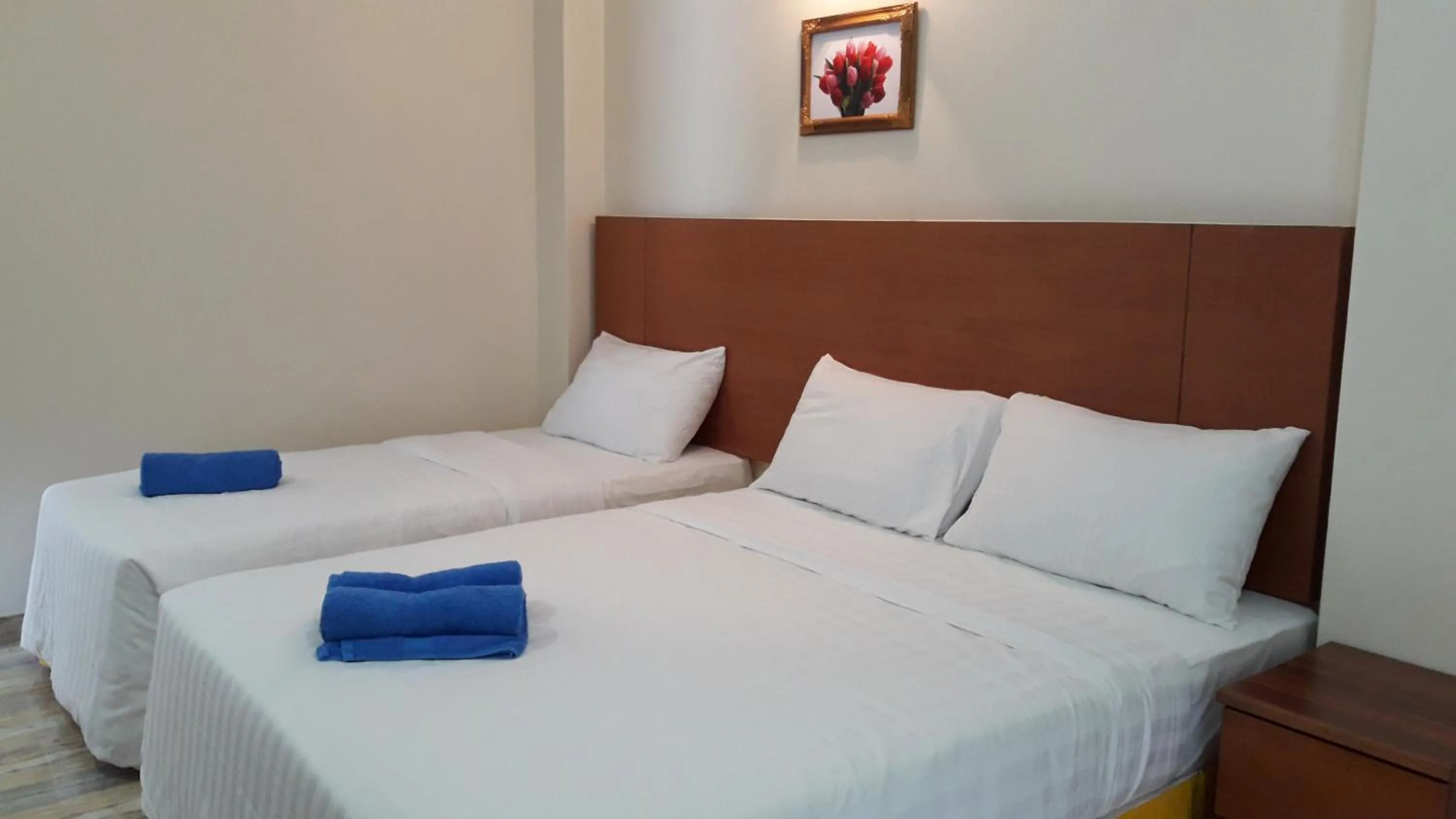 Bed in TULIP HOTEL & APARTMENT