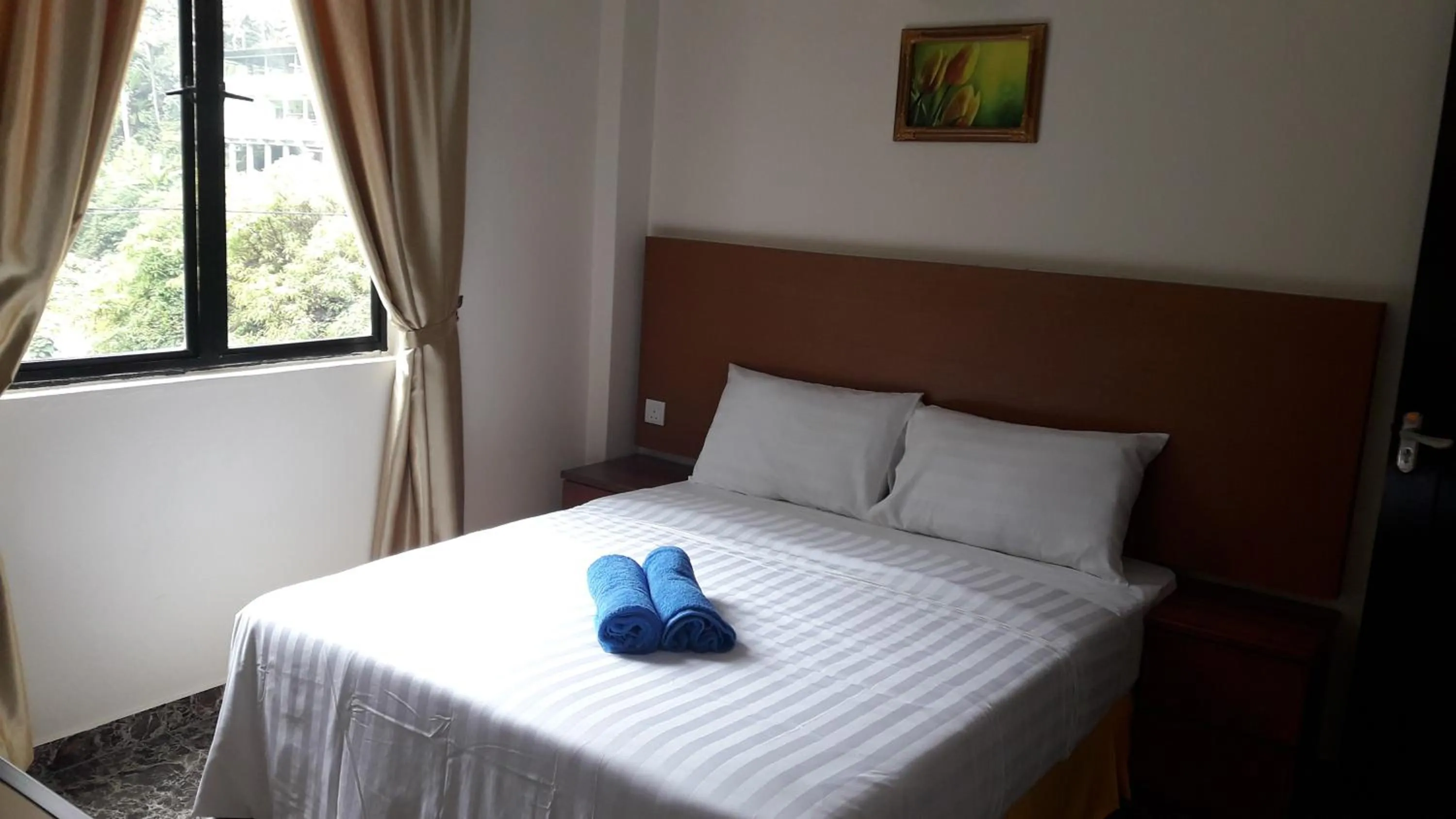 Bed in TULIP HOTEL & APARTMENT
