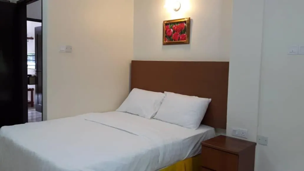 Bed in TULIP HOTEL & APARTMENT