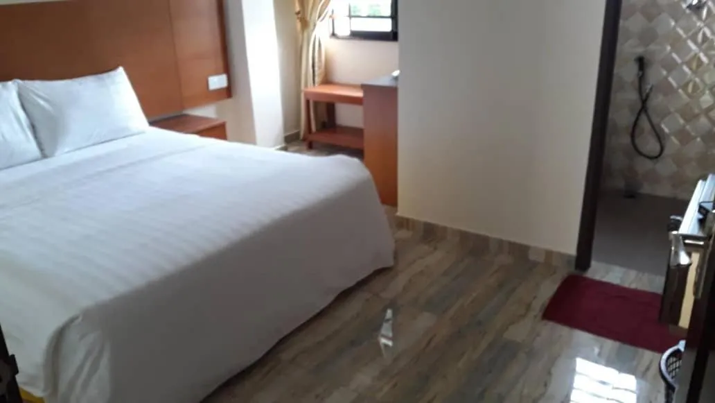 Bed in TULIP HOTEL & APARTMENT