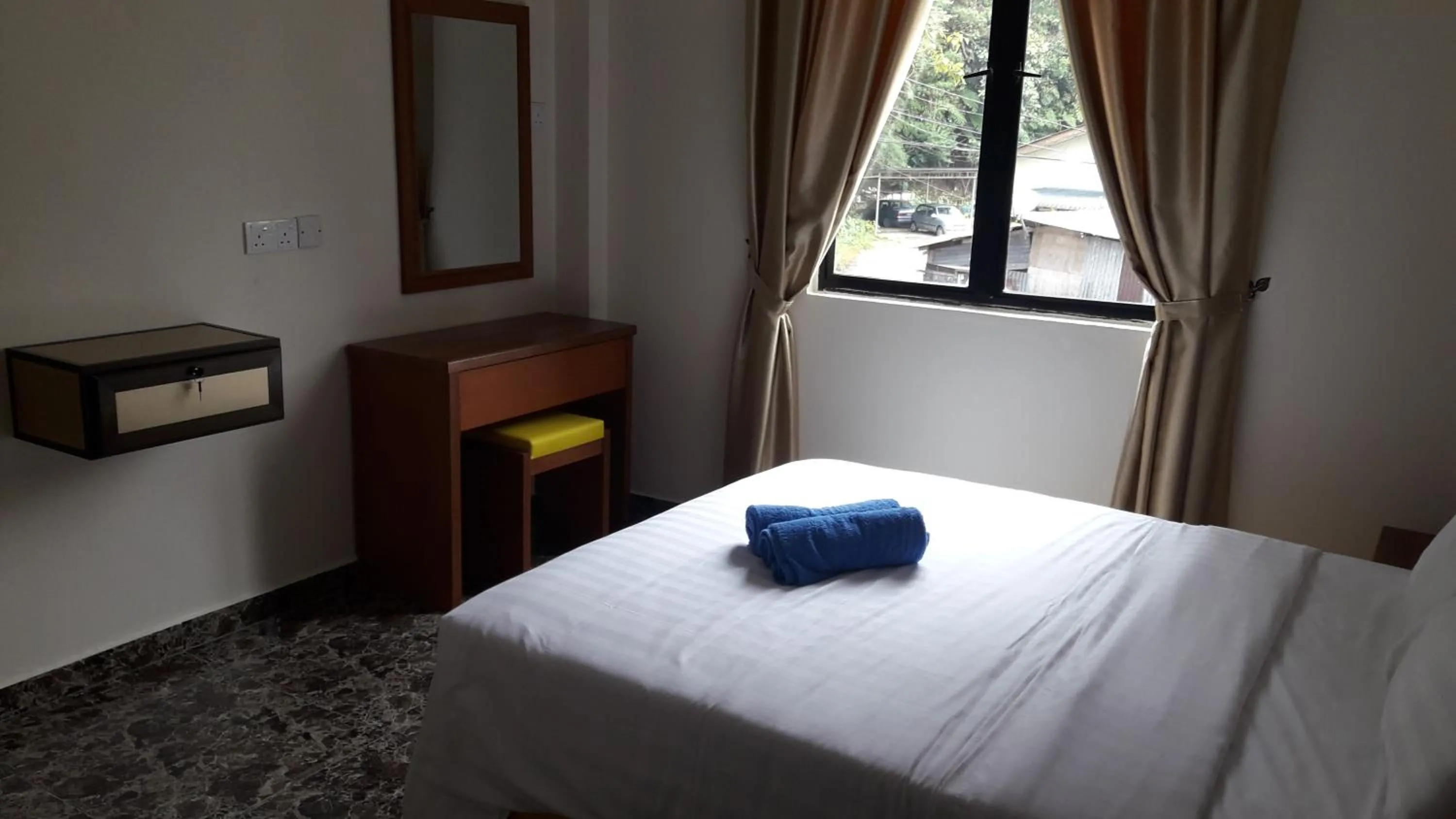 Bed in TULIP HOTEL & APARTMENT
