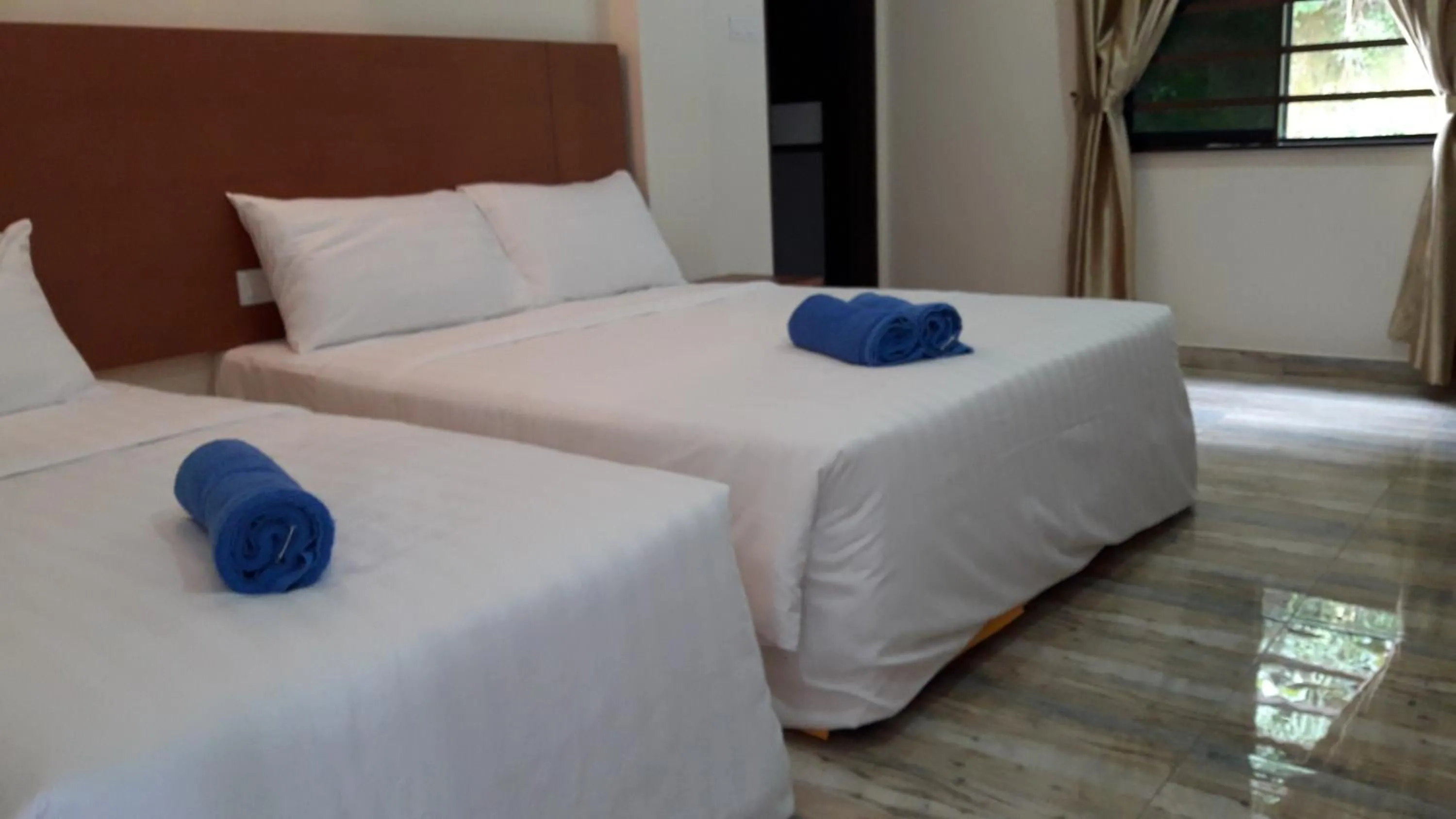 Bed in TULIP HOTEL & APARTMENT