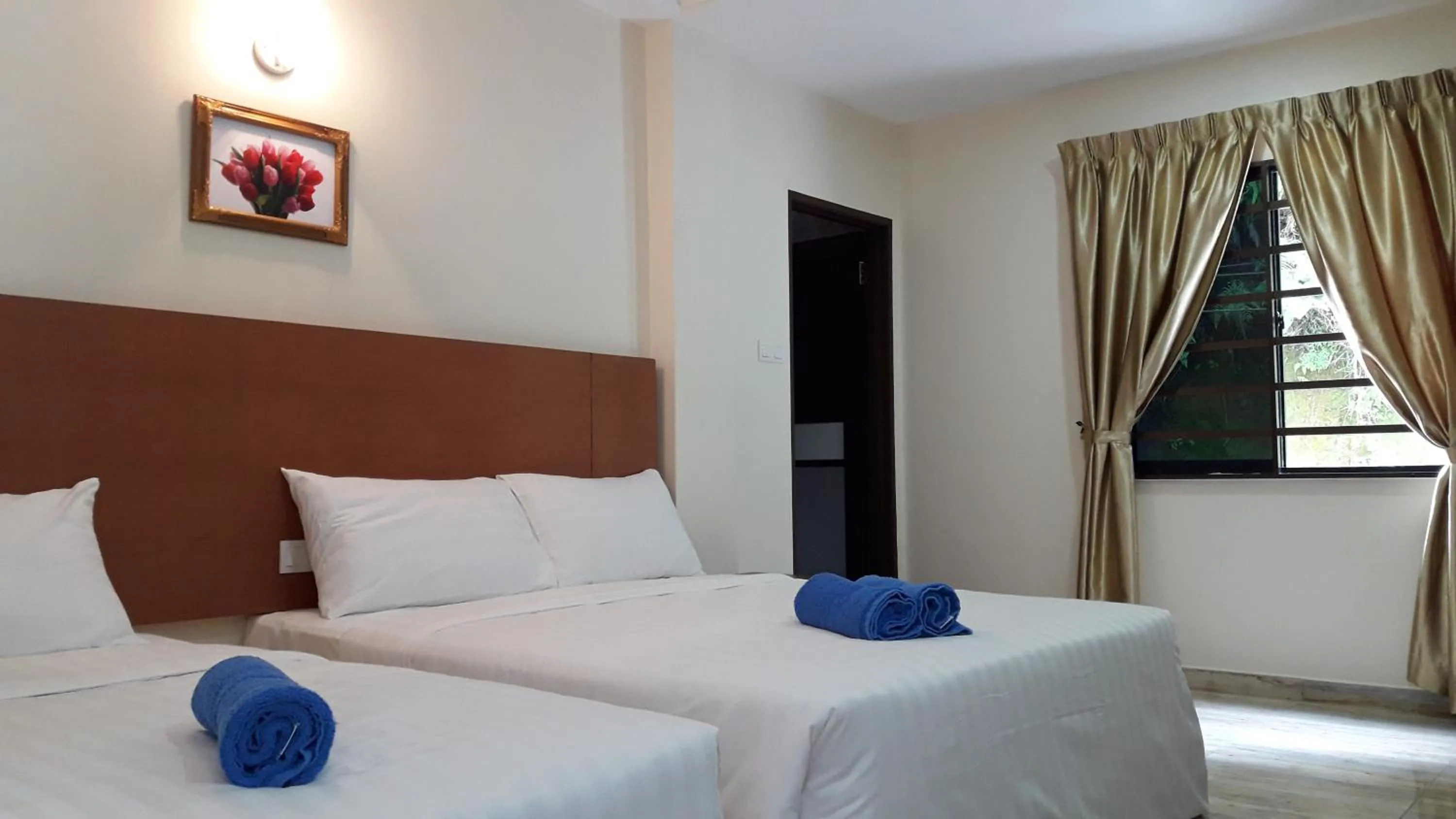 Bed in TULIP HOTEL & APARTMENT