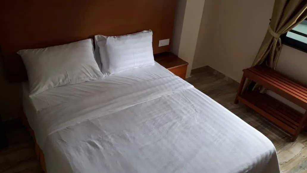 Bed in TULIP HOTEL & APARTMENT