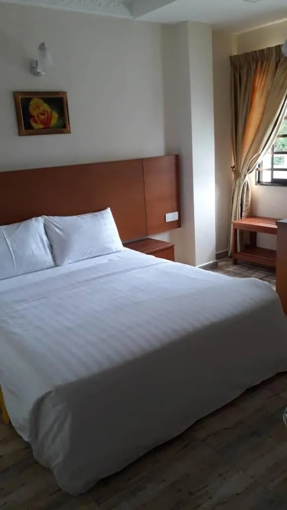 Bed in TULIP HOTEL & APARTMENT