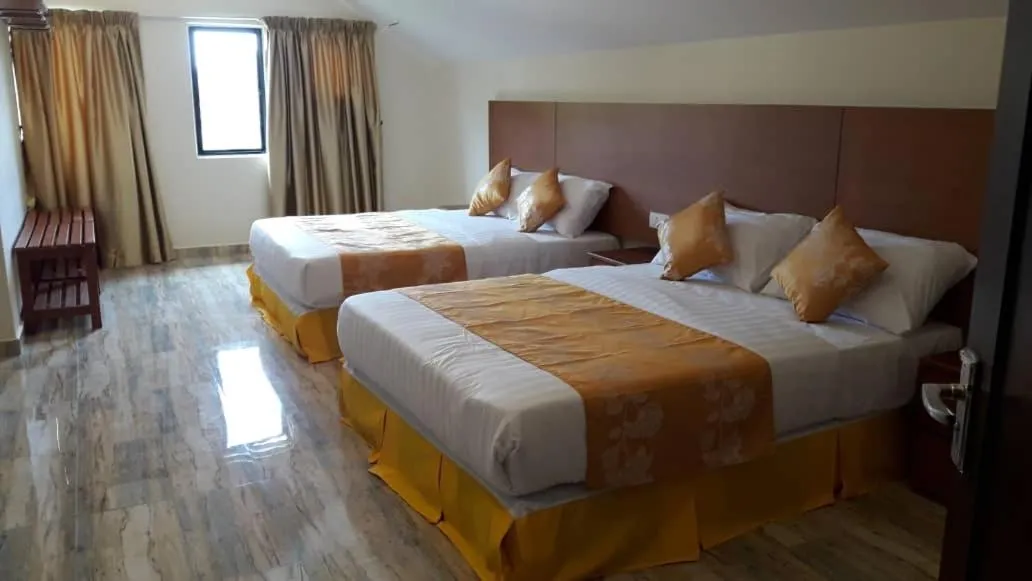 Bed in TULIP HOTEL & APARTMENT