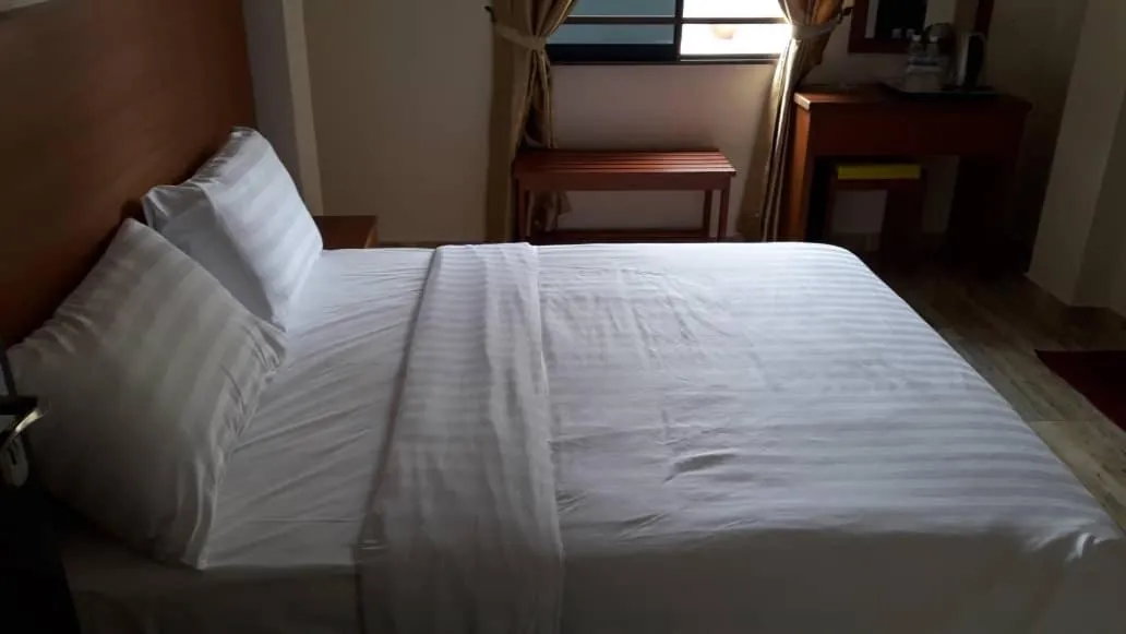 Bed in TULIP HOTEL & APARTMENT
