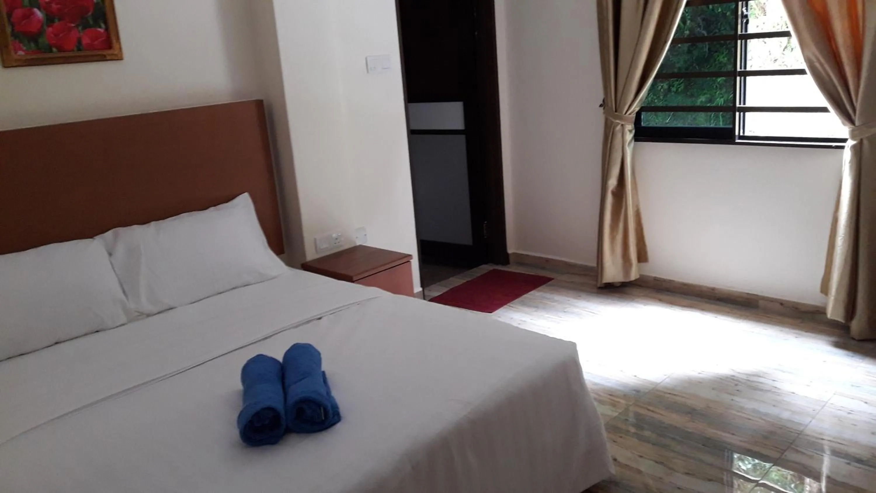 Bed in TULIP HOTEL & APARTMENT