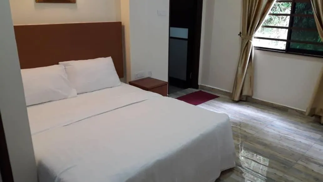 Bed in TULIP HOTEL & APARTMENT