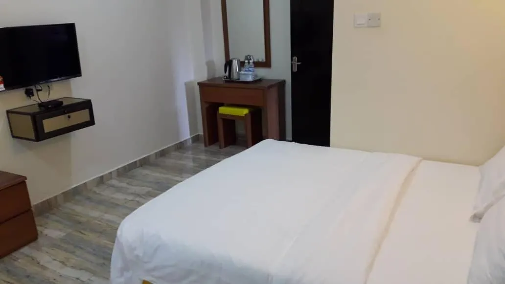 Bed in TULIP HOTEL & APARTMENT