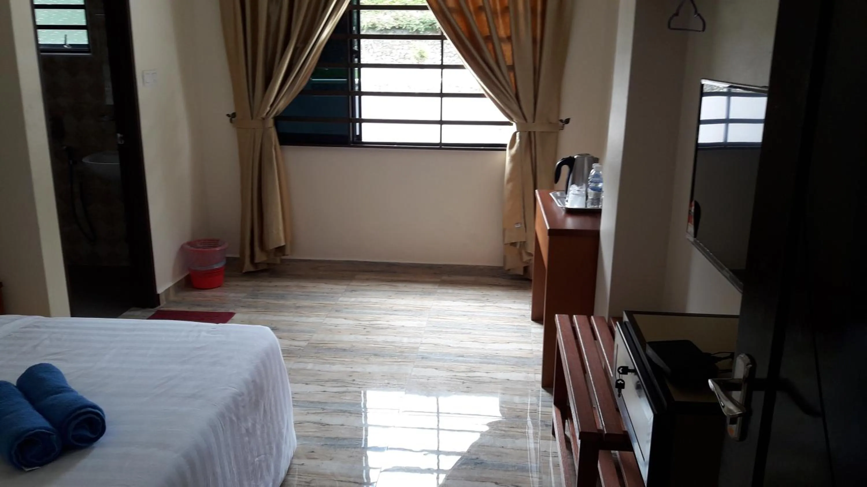 Bed in TULIP HOTEL & APARTMENT