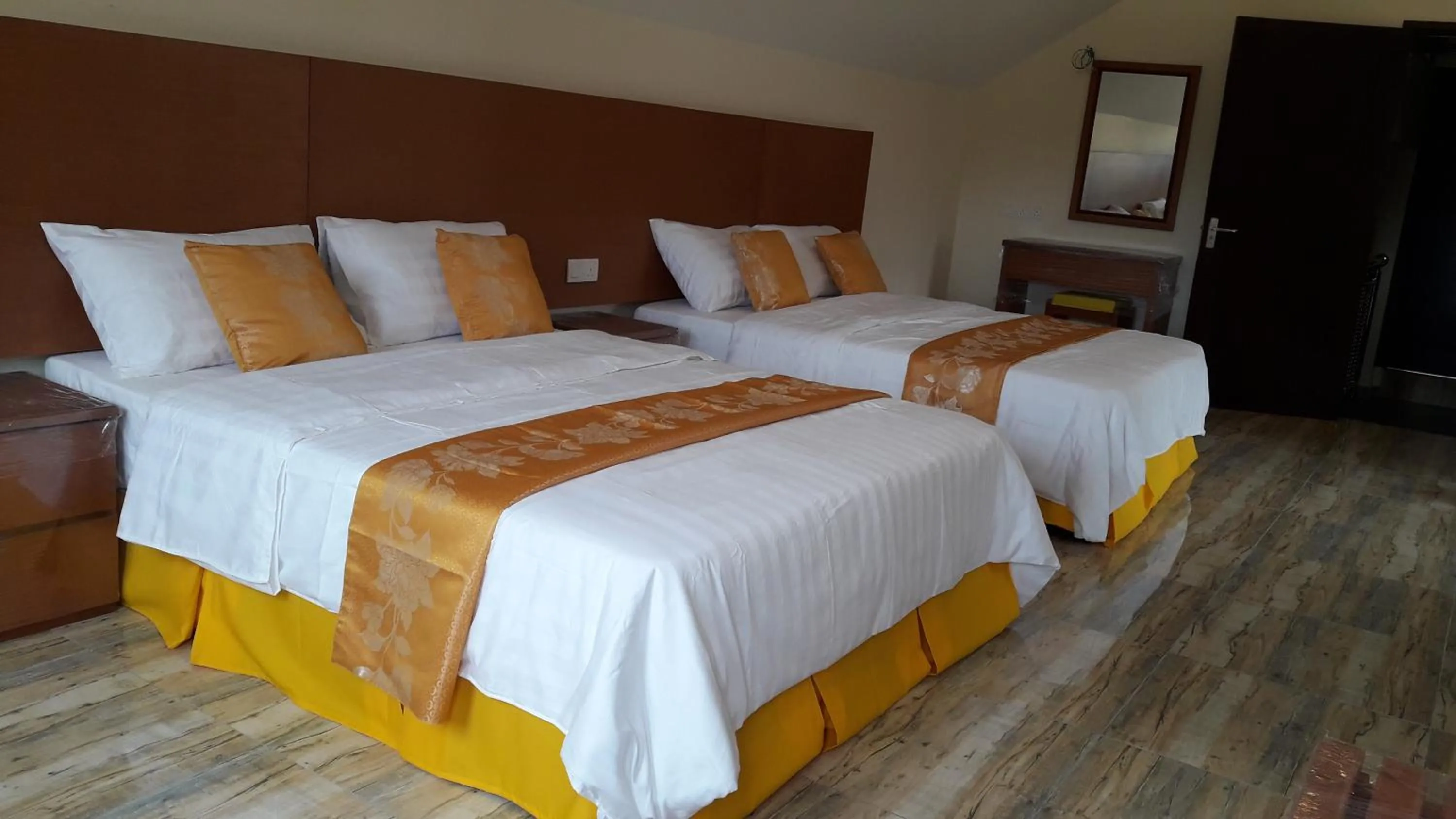 Bed in TULIP HOTEL & APARTMENT