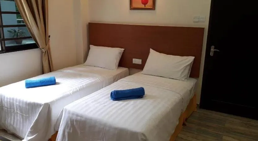 Bed in TULIP HOTEL & APARTMENT