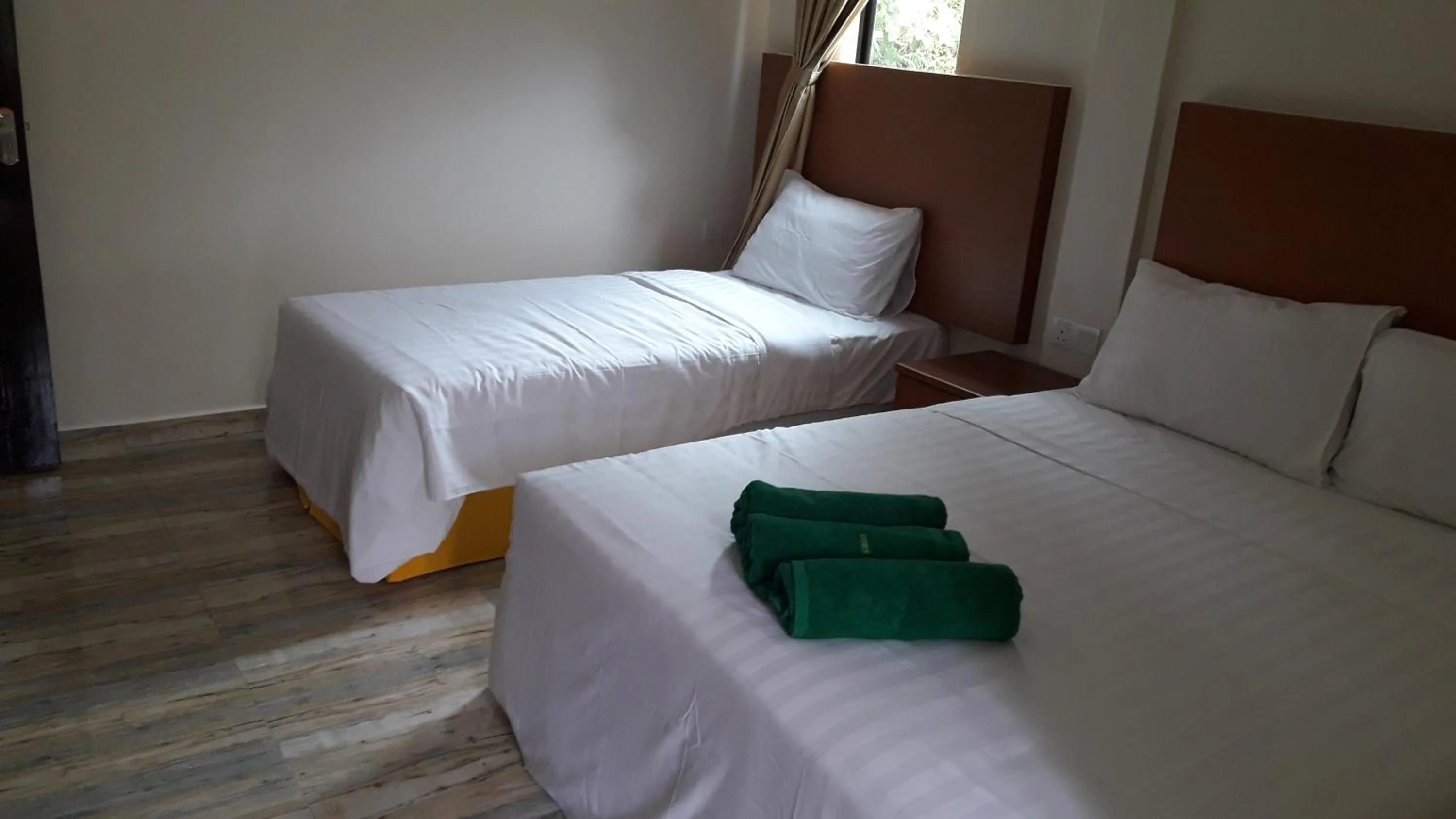 Bed in TULIP HOTEL & APARTMENT