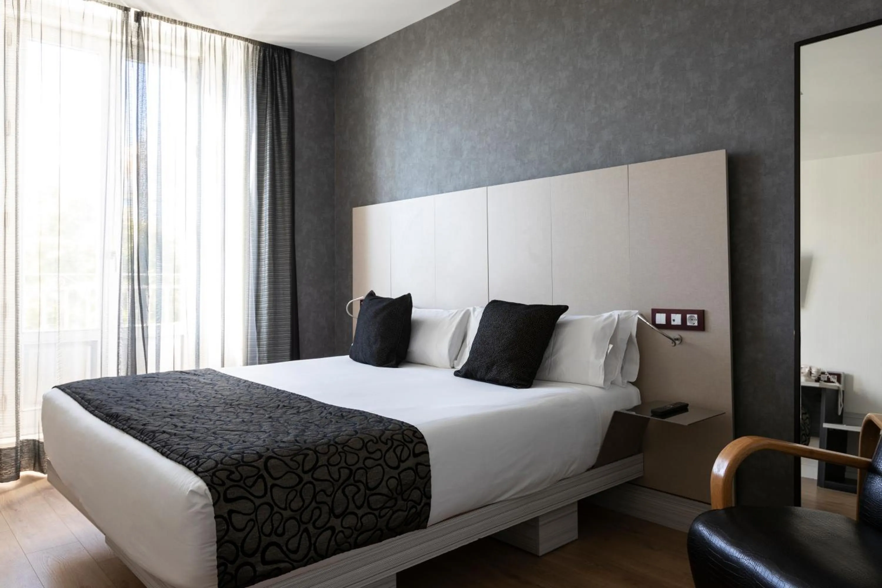 Bed in Petit Palace Santa Bárbara