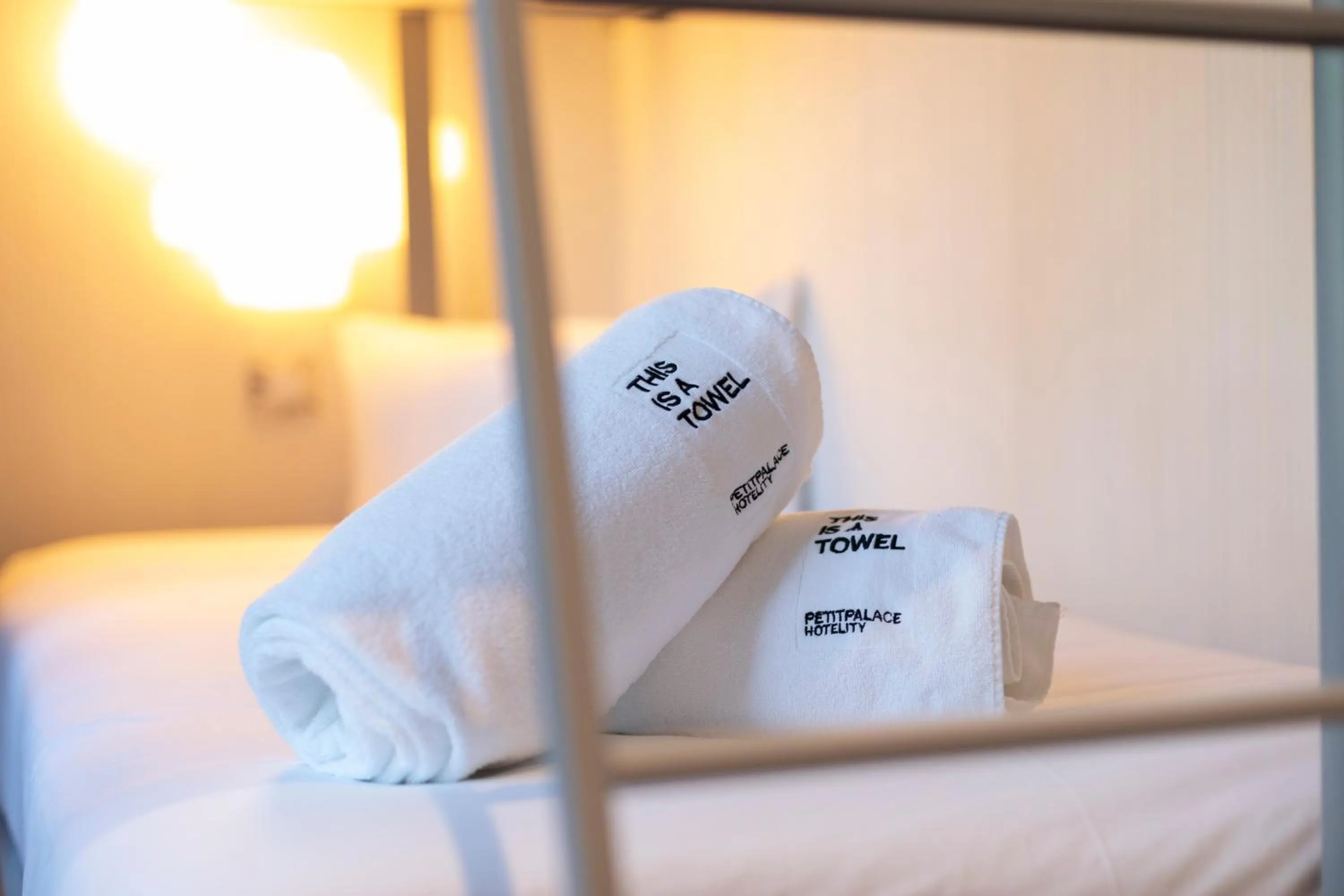 towels, Bed in Petit Palace Santa Bárbara