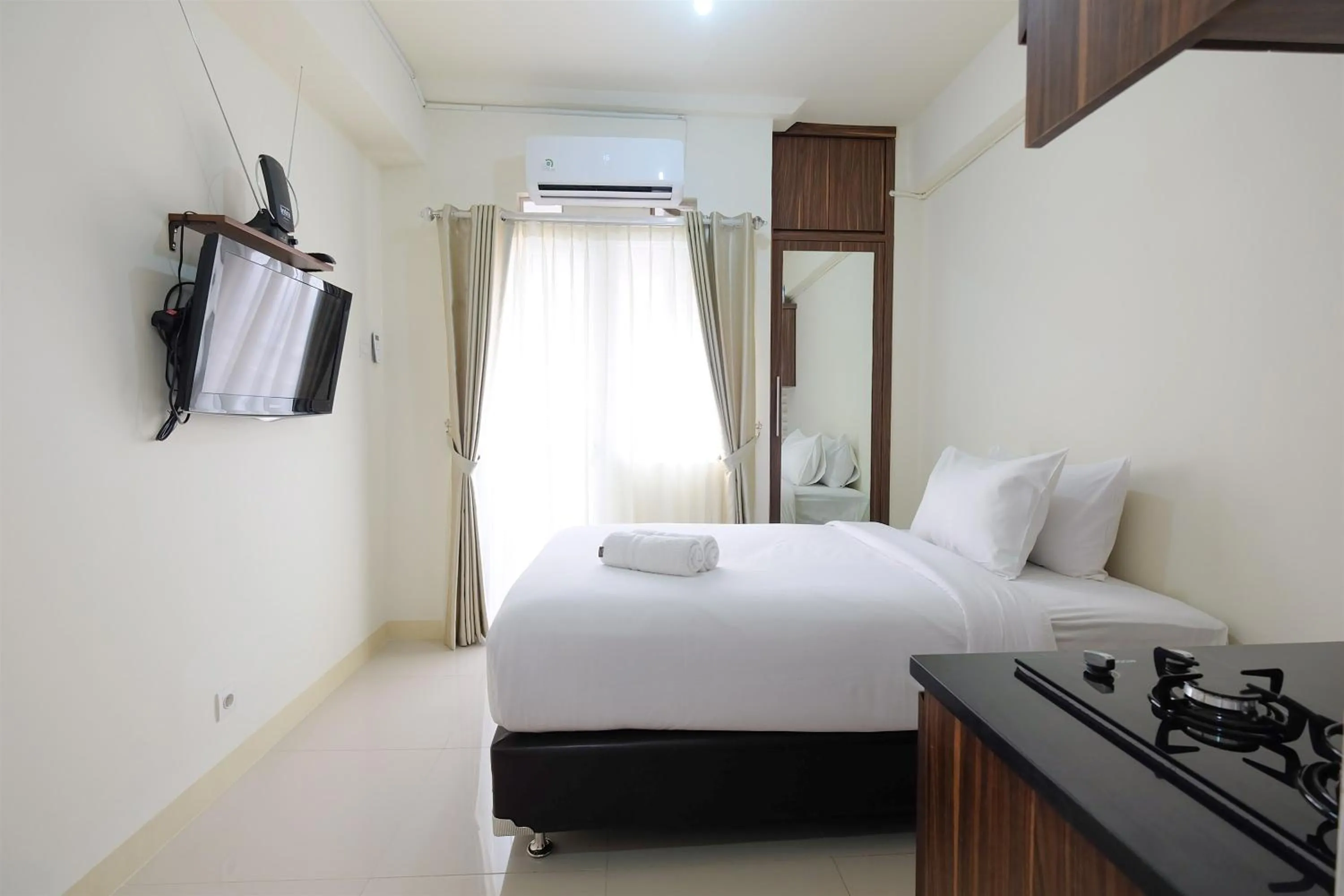 Apartment in Comfy Studio Apartment @ Green Pramuka City By Travelio